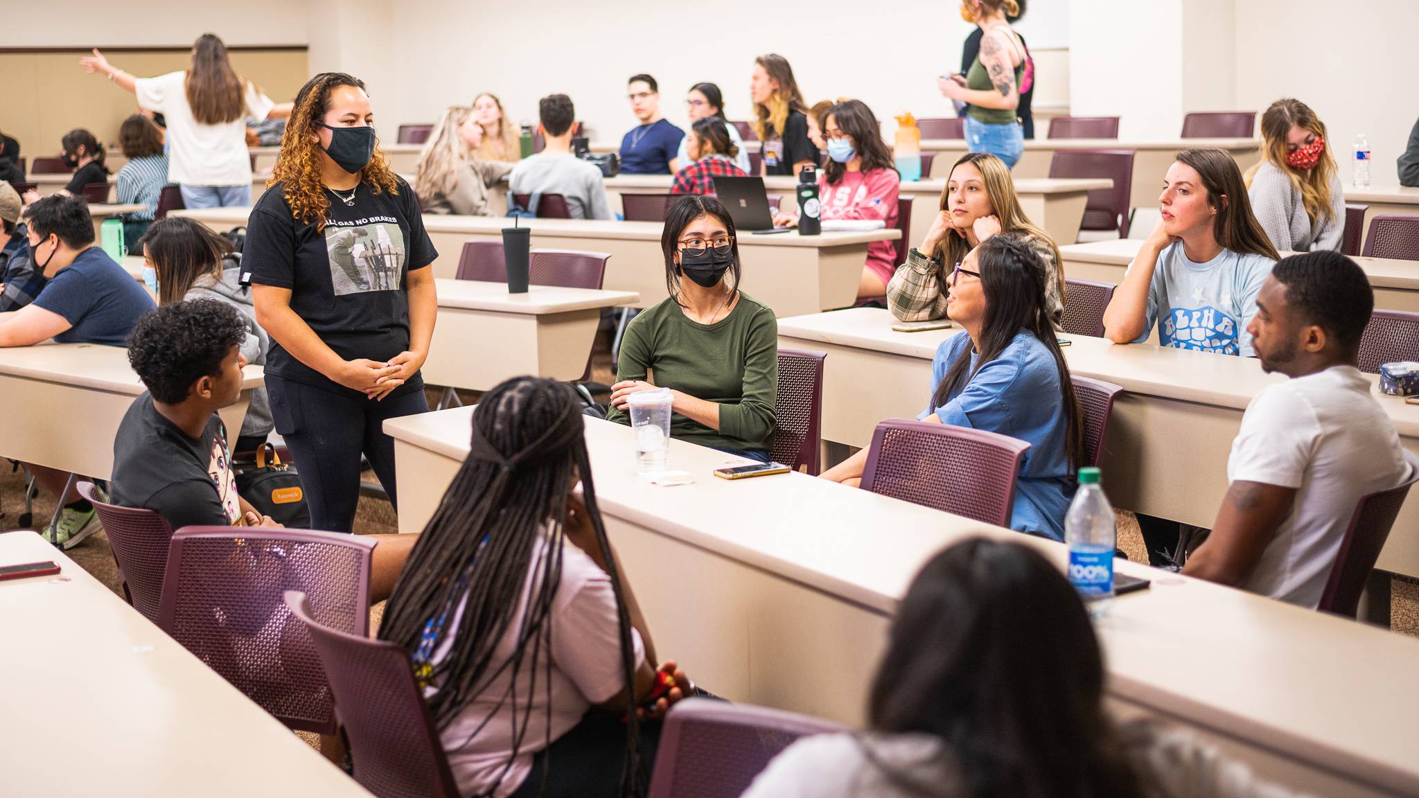 an image depicting sociology club members engaged in a discussion