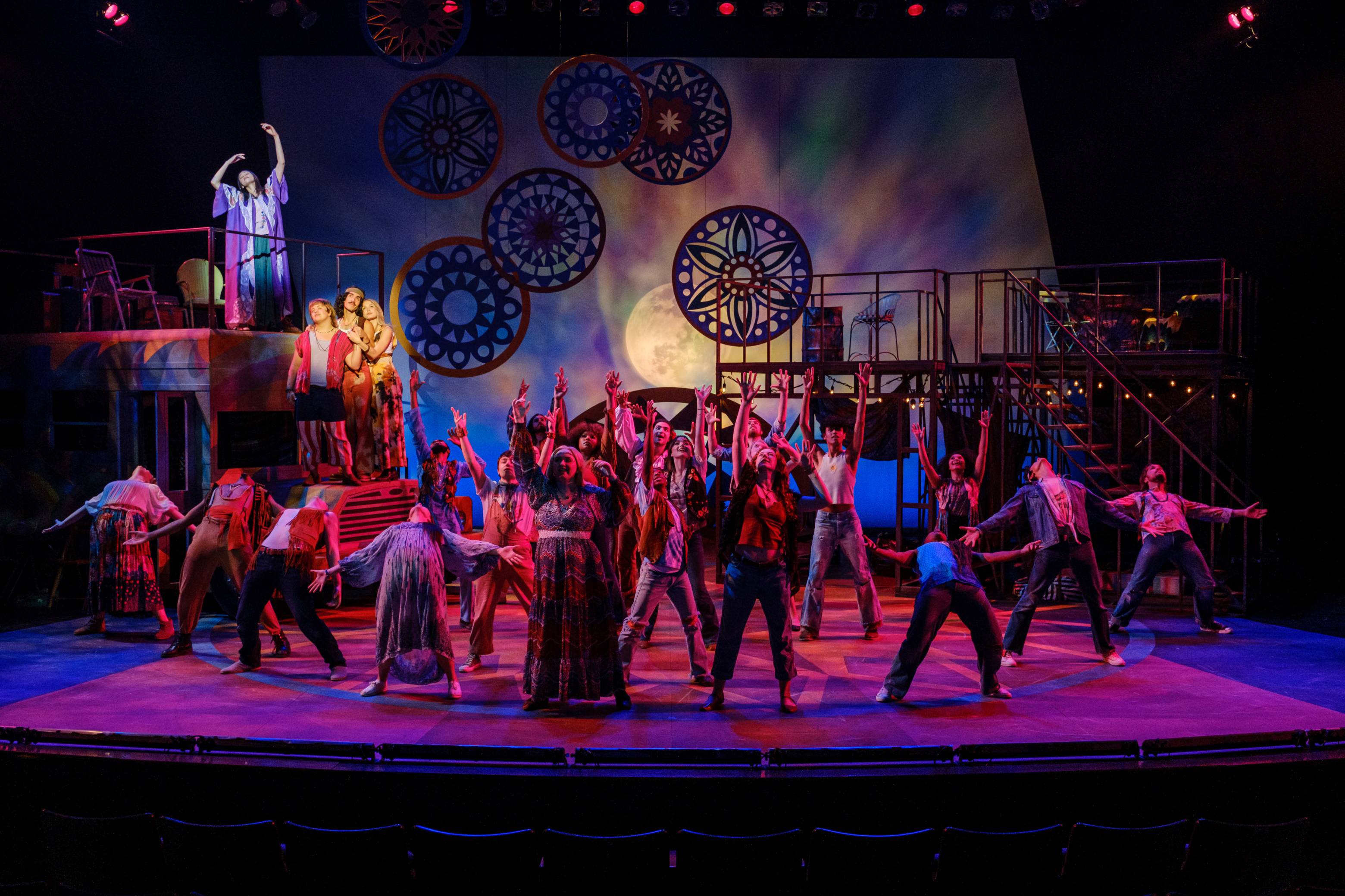 The cast of Hair performing the opening number Aquarius at Texas State University