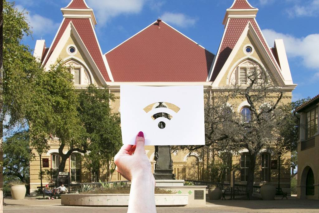 wifi icon image with TXST Old Main in background