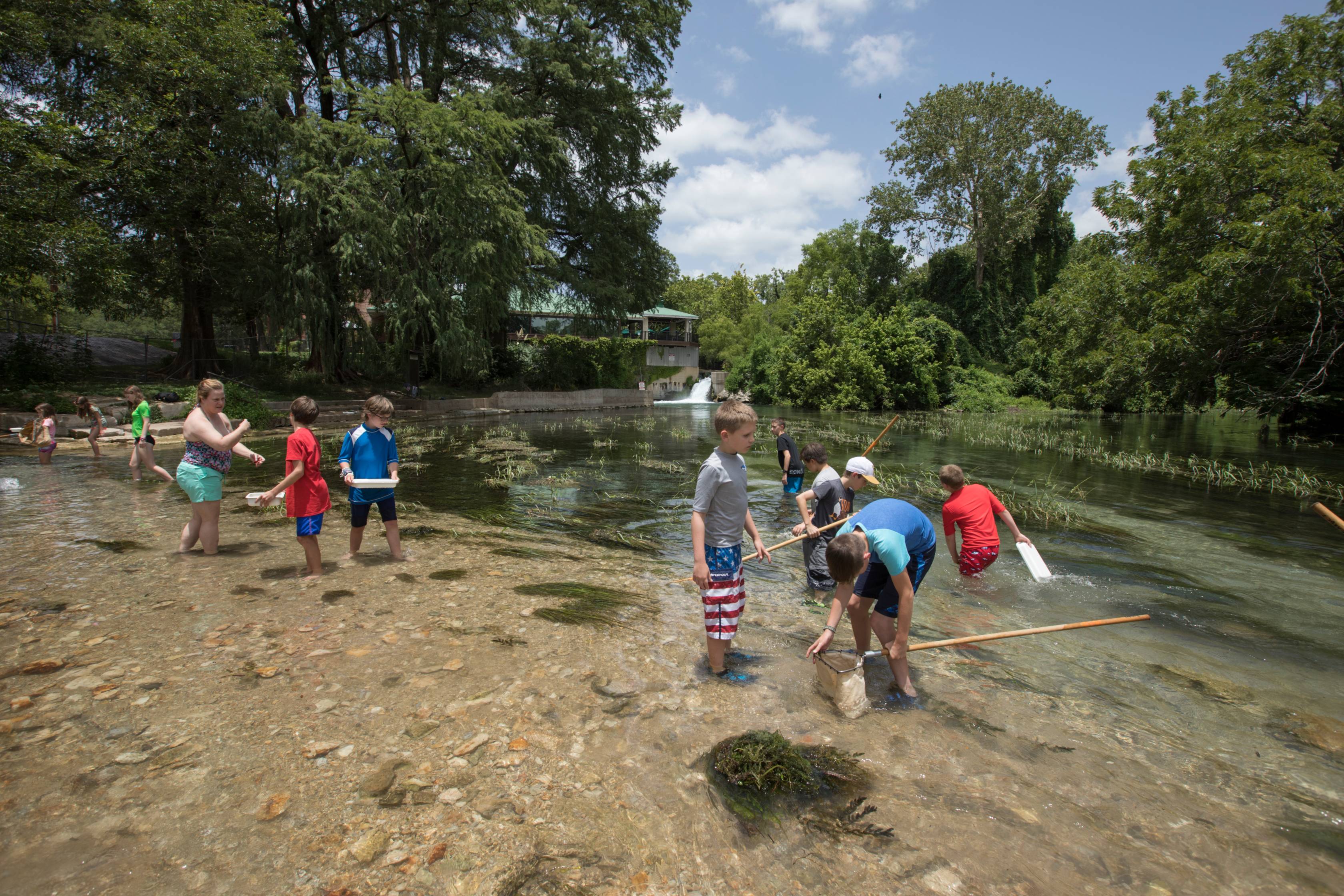 camp kids in river