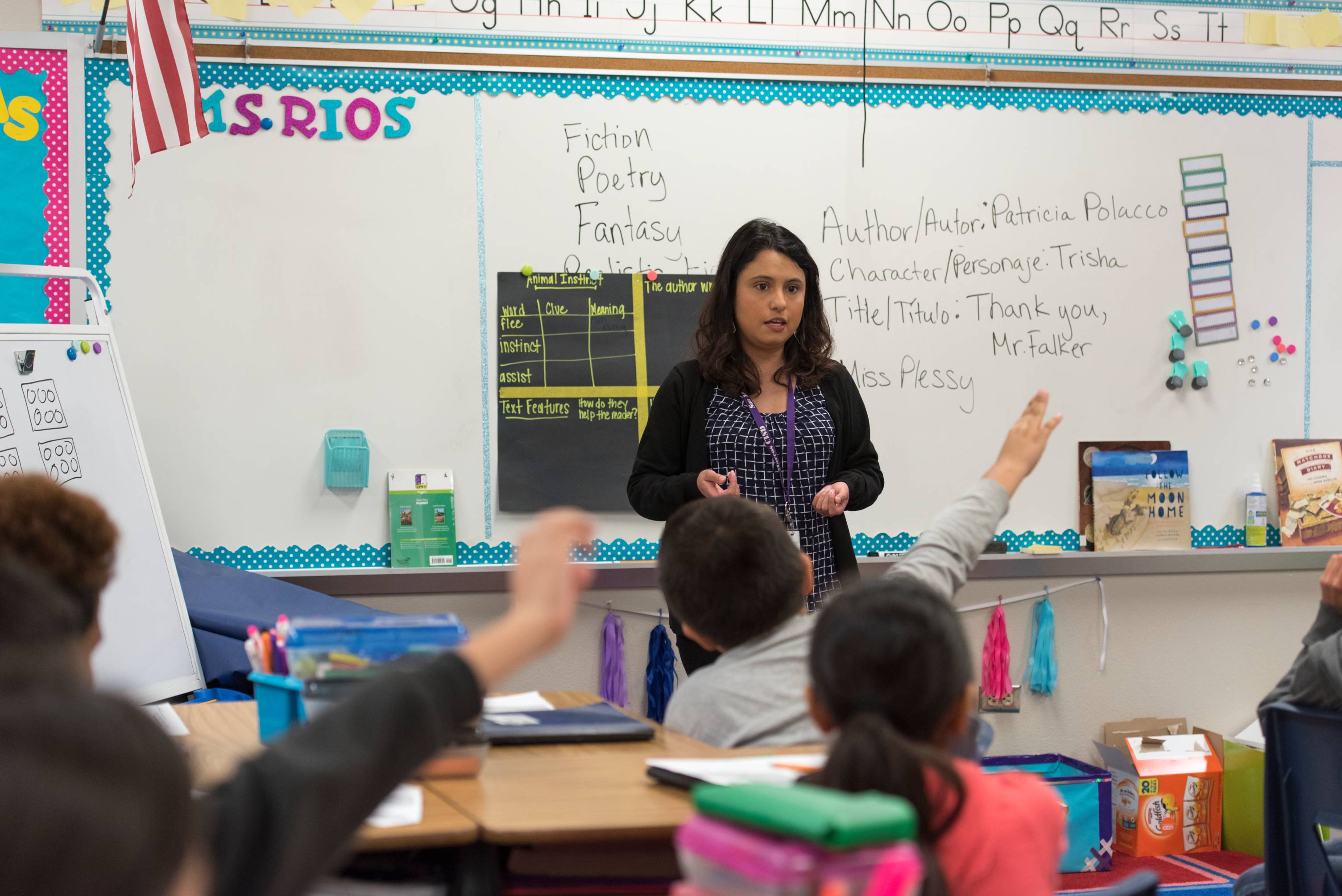 teacher with students in a classroom