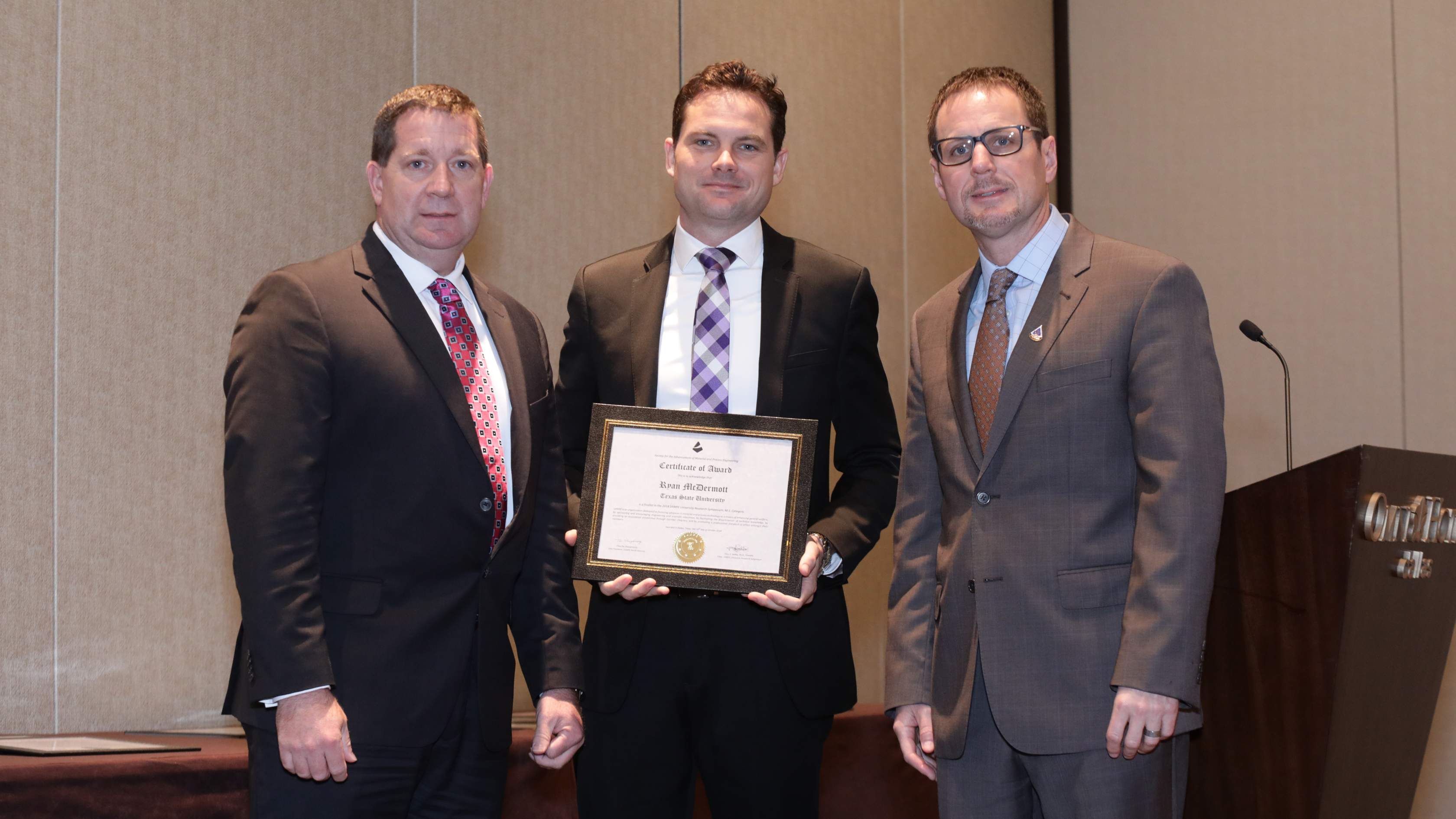 Ryan J. McDermott (middle) won first prize in the 2018 CAMX URS Competition held in Dallas,TX