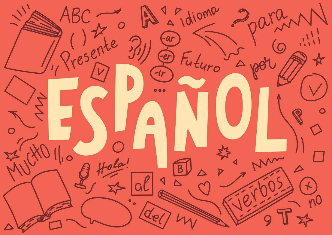 "Hablas Espanol" written on a chalk board.