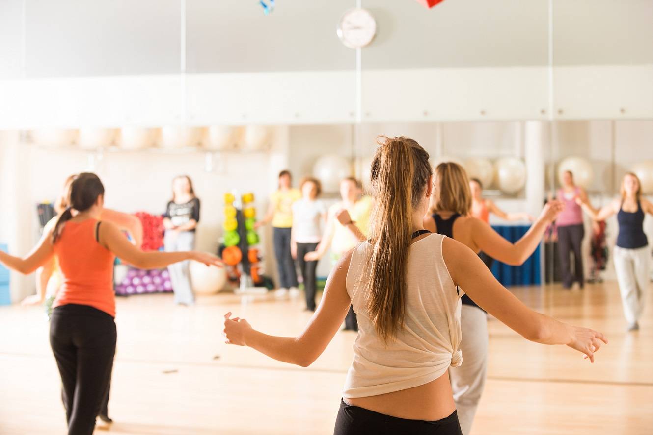 Women in a dance studio practicing.