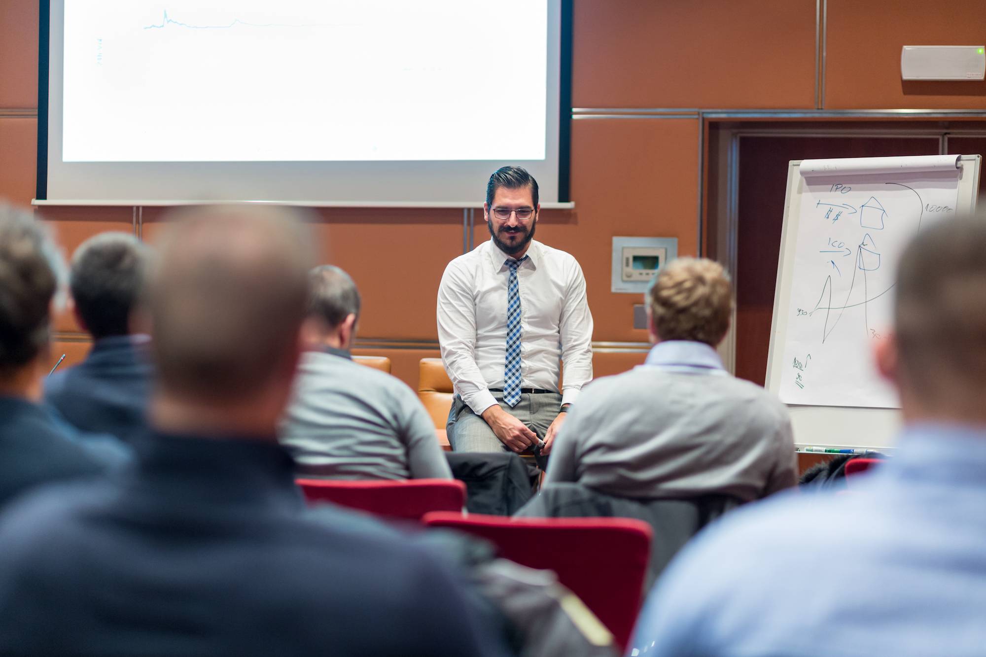 Instructor with students at a table