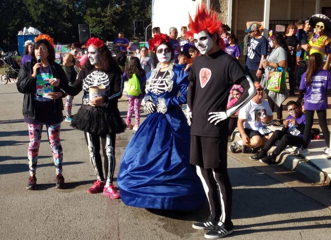 people dressed up in day of the dead costumes