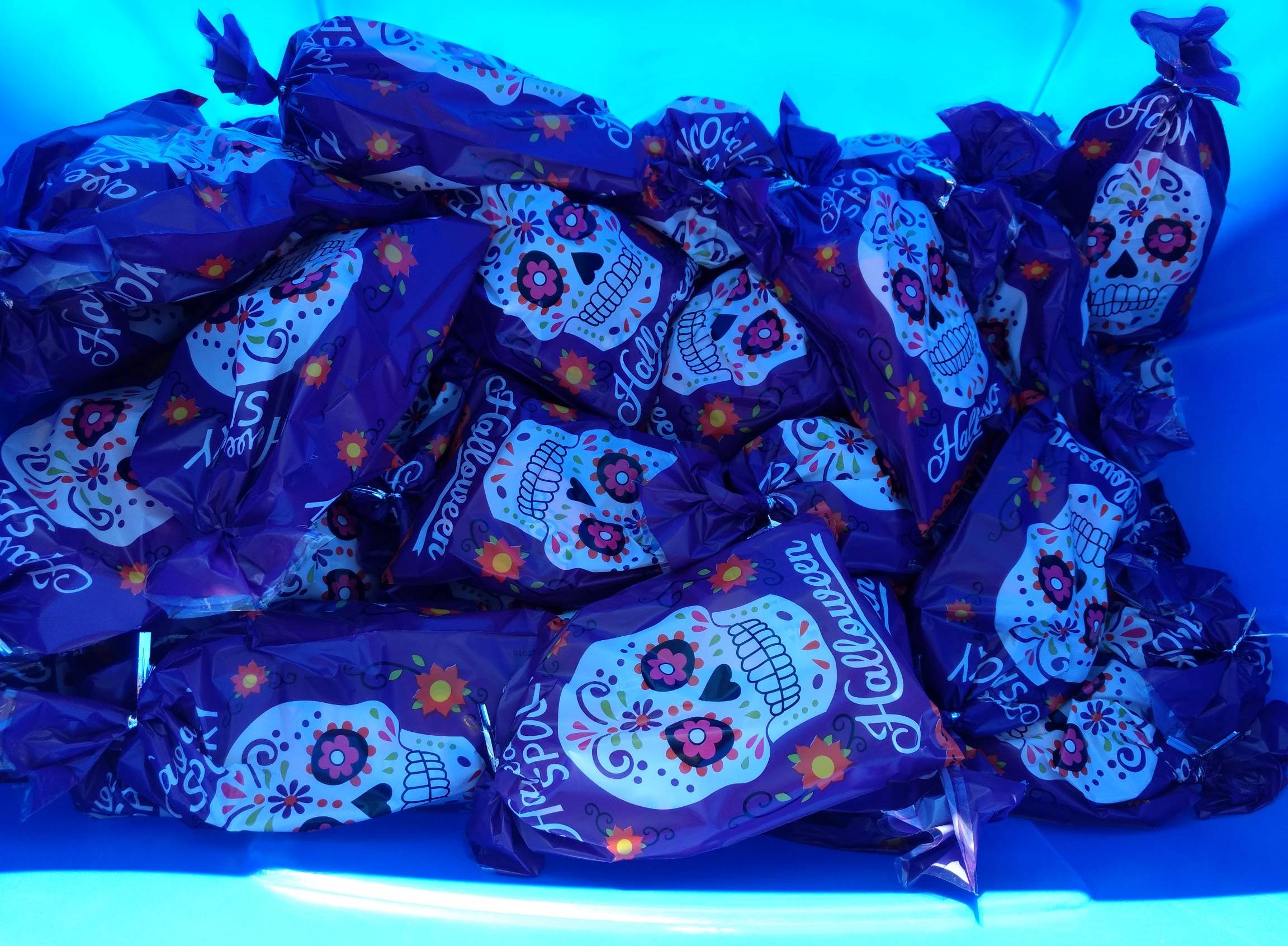 blue goodie bags with sugar skulls