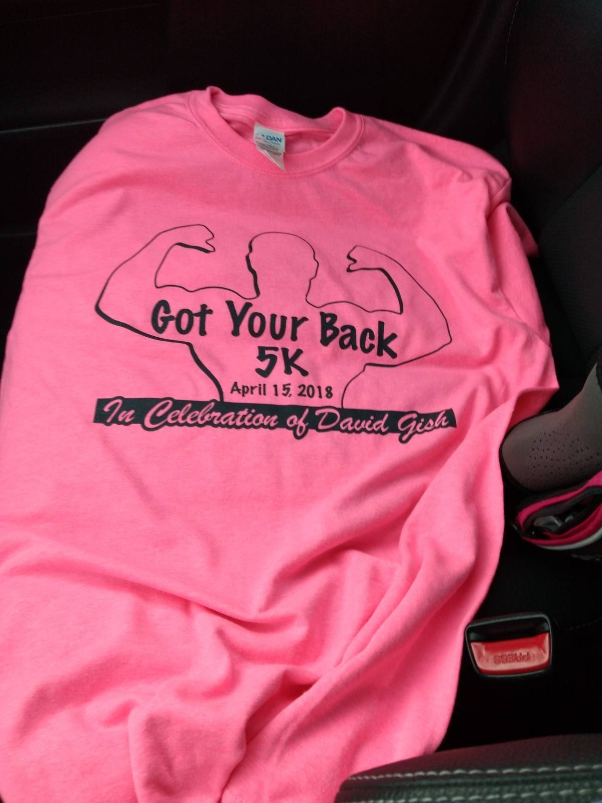 an image of the hot pink event t-shirt which has the words "got your back 5k" on it