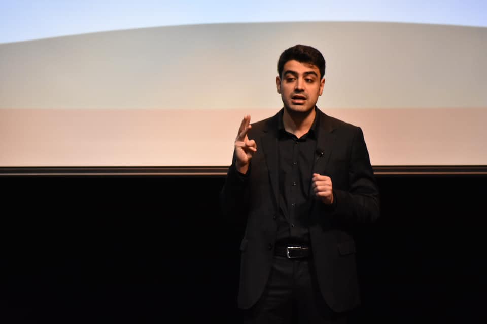 Faraz Moghimi giving a presentation