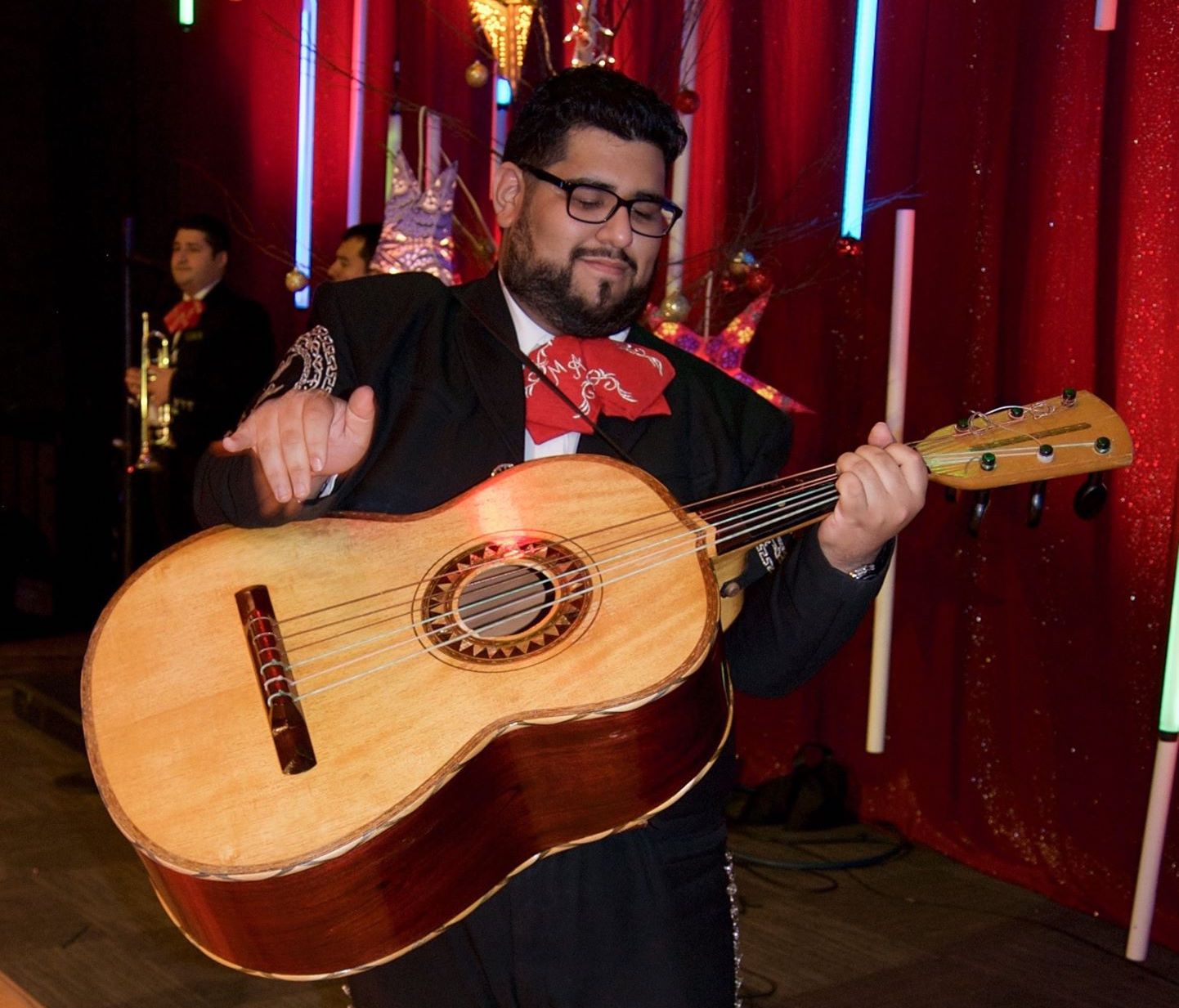 Photo of Miguel Cervantes playing the guitar