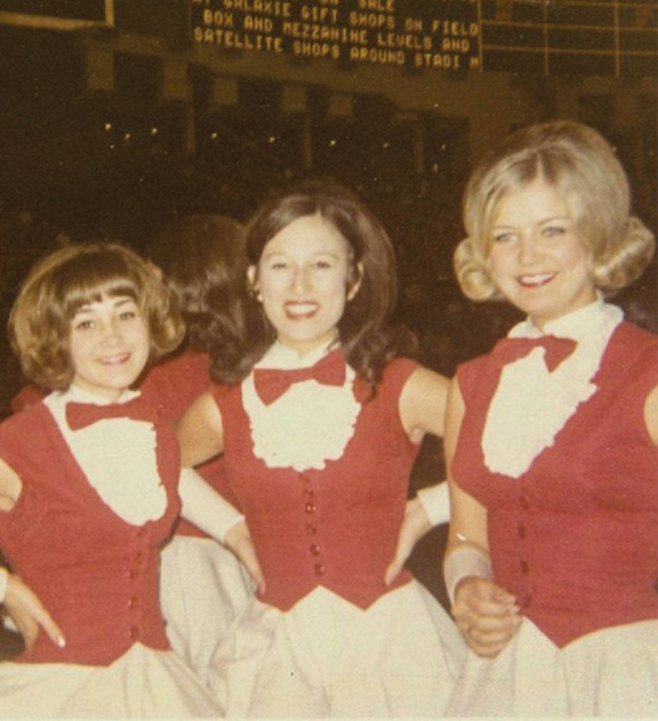 three women in strutters outfits