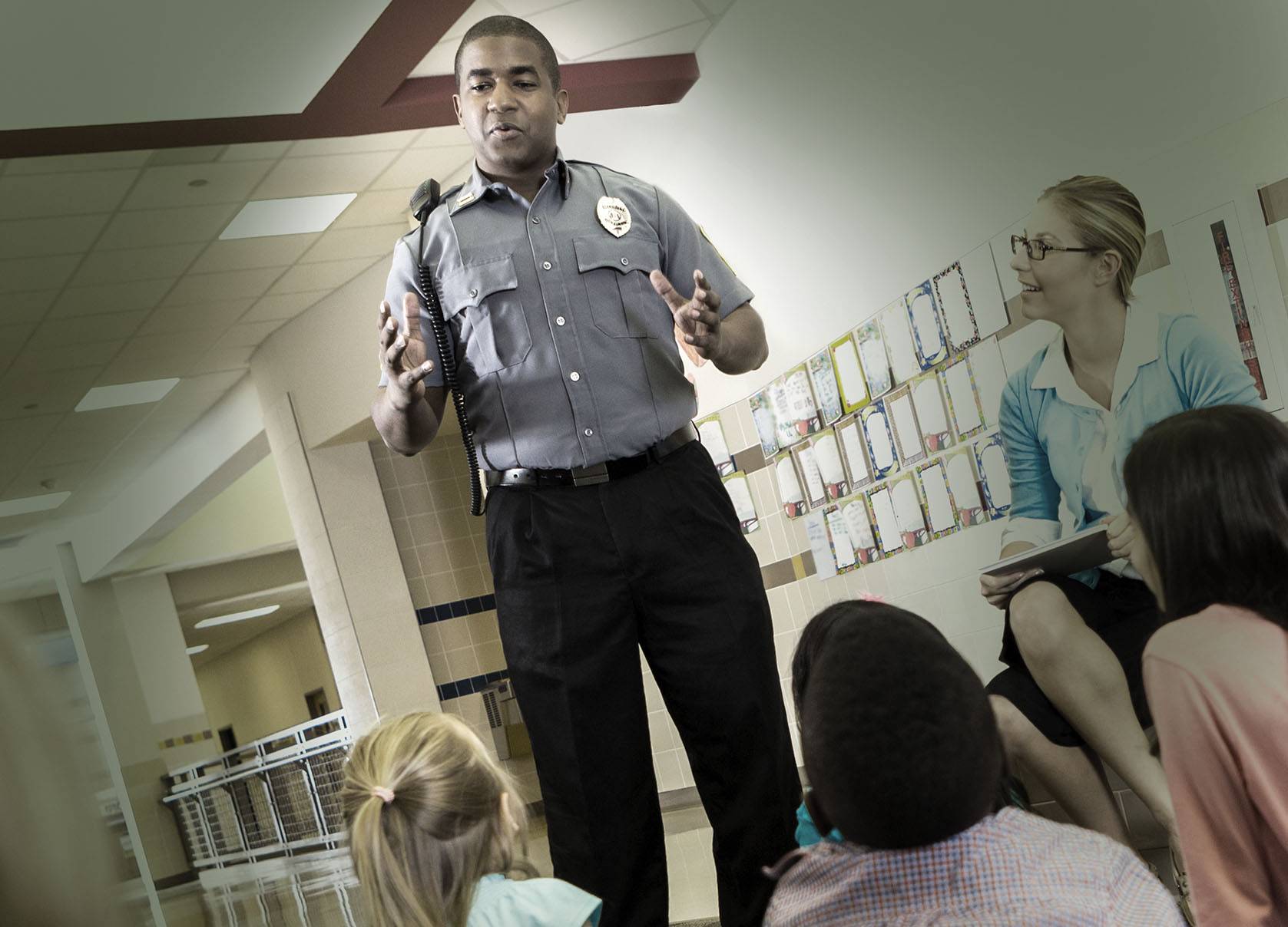 cop talking to children