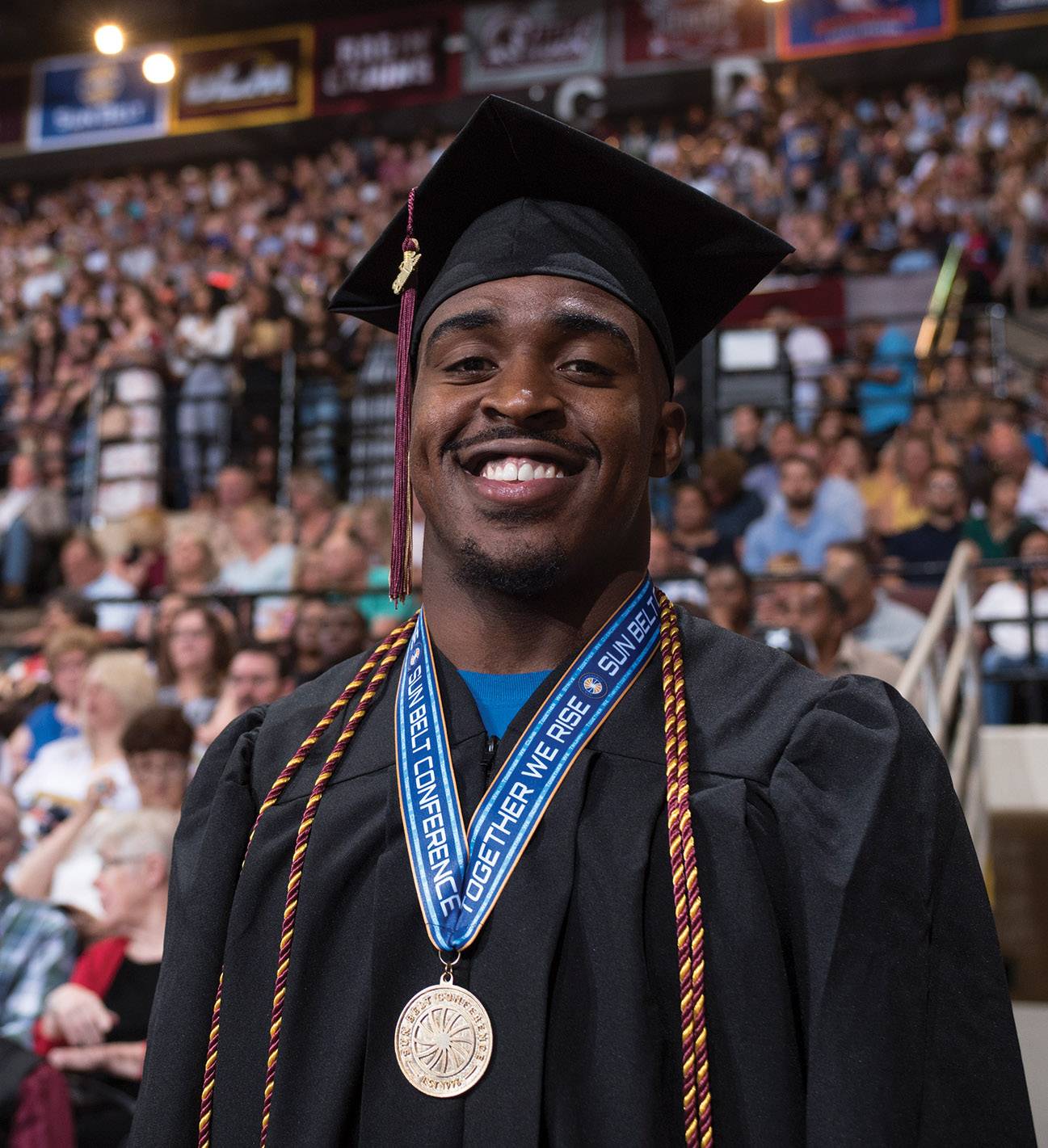 bryan london in graduation gown and cap