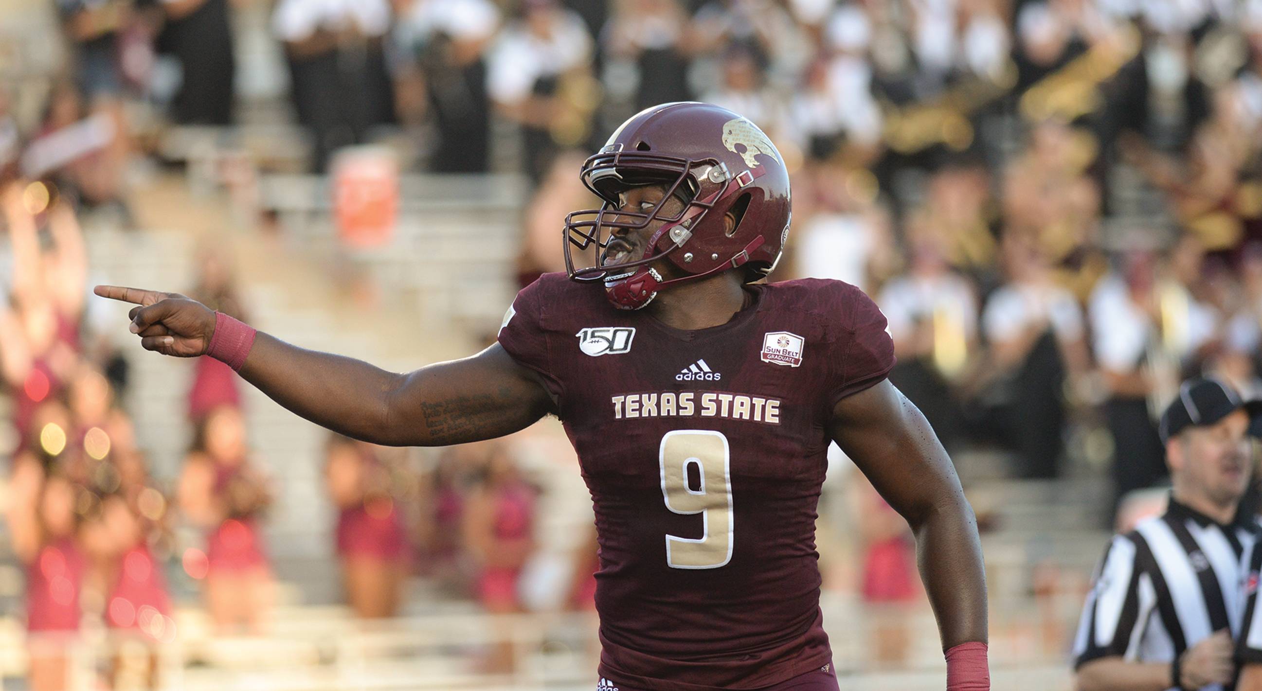 man in texas state football uniform