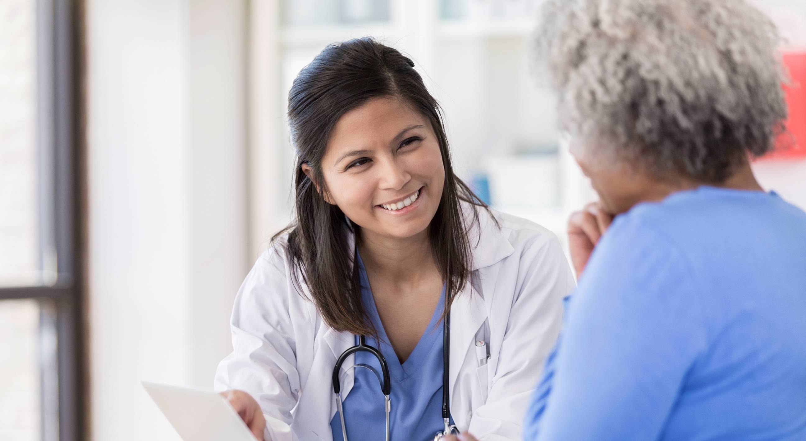 nurse talking with patient