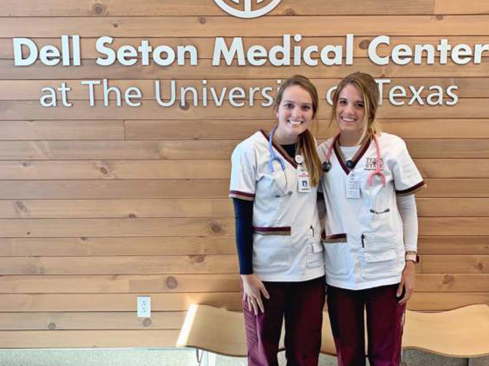 two female students in medical scrubs