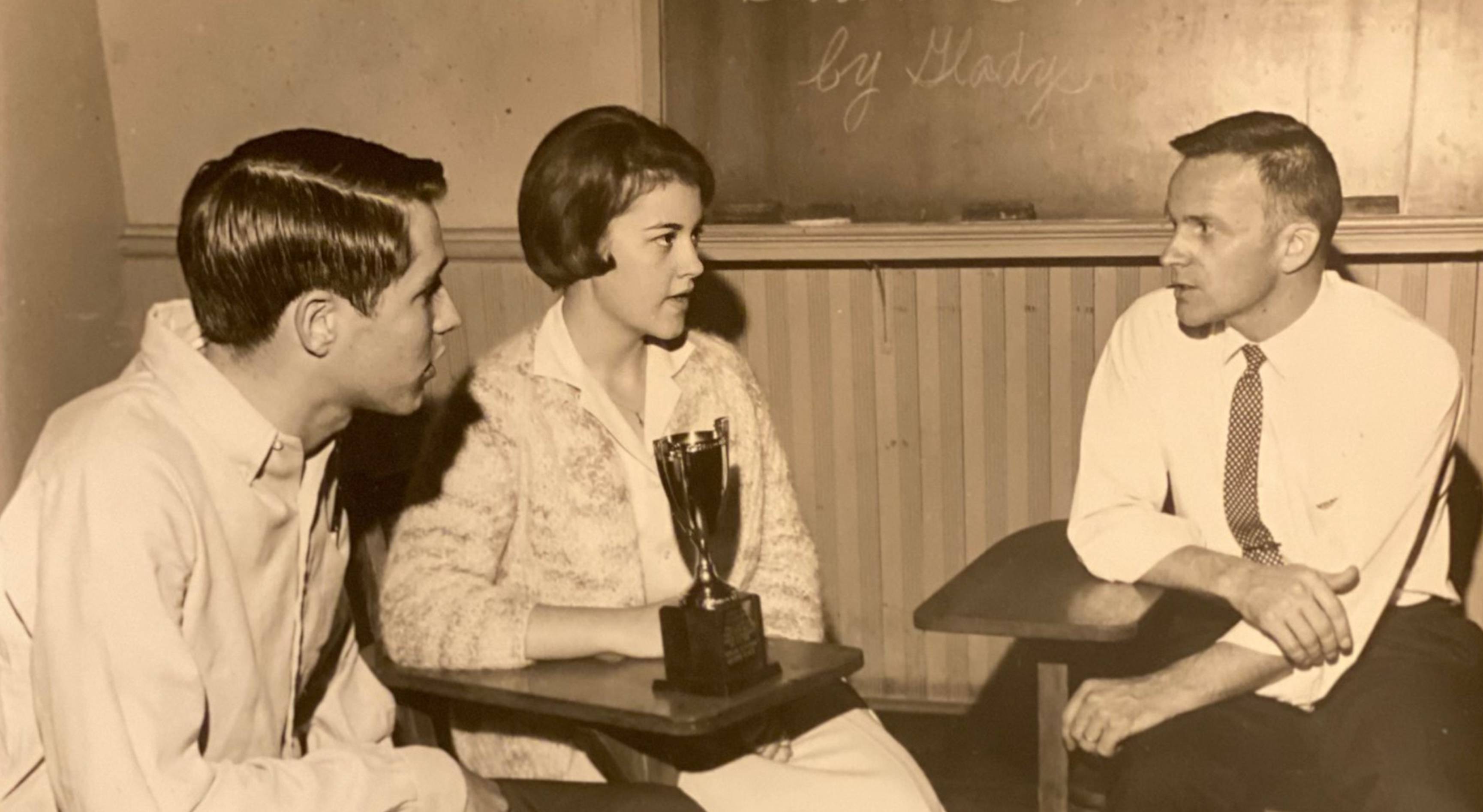 old photo of roz baker and two male students