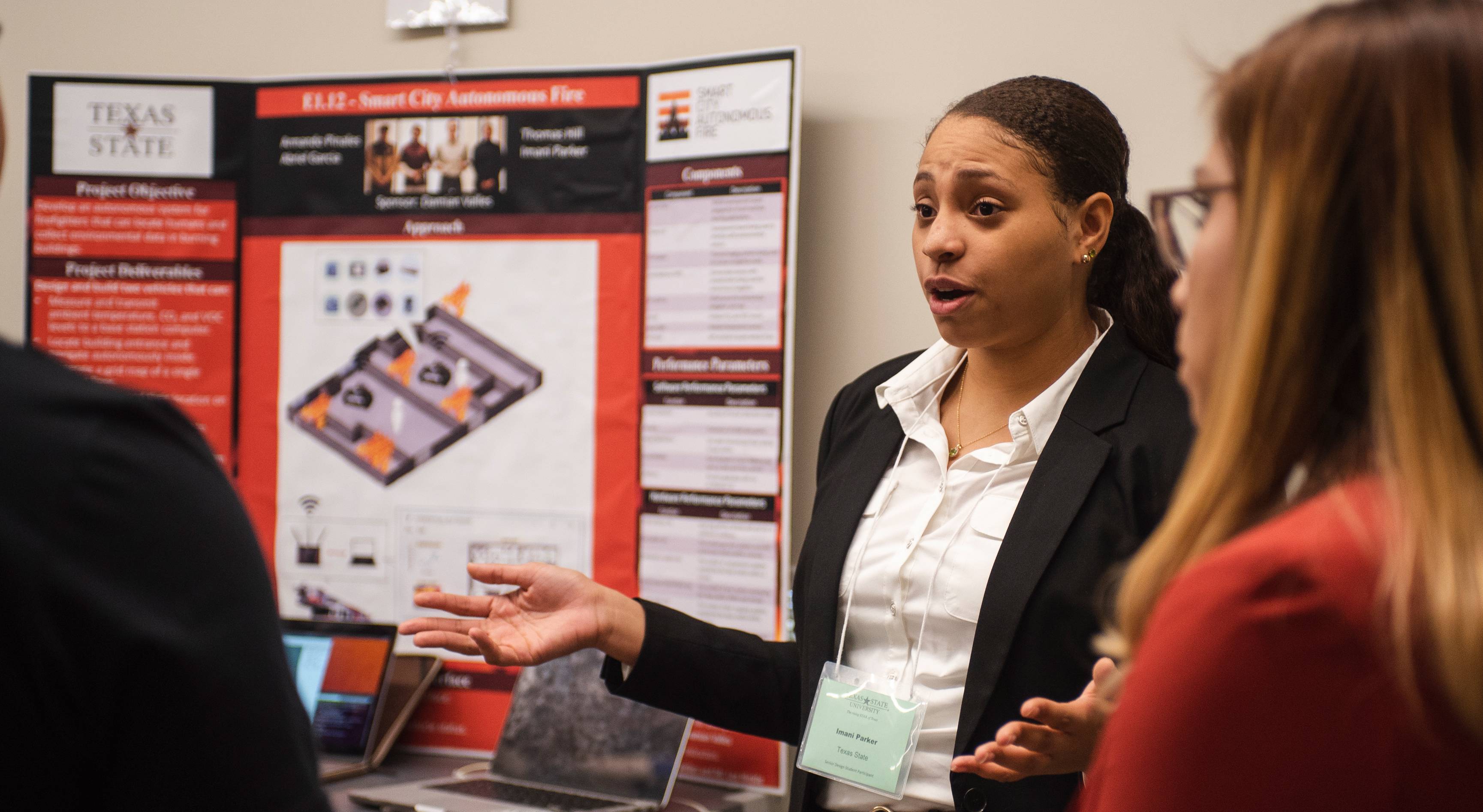 woman presenting research poster