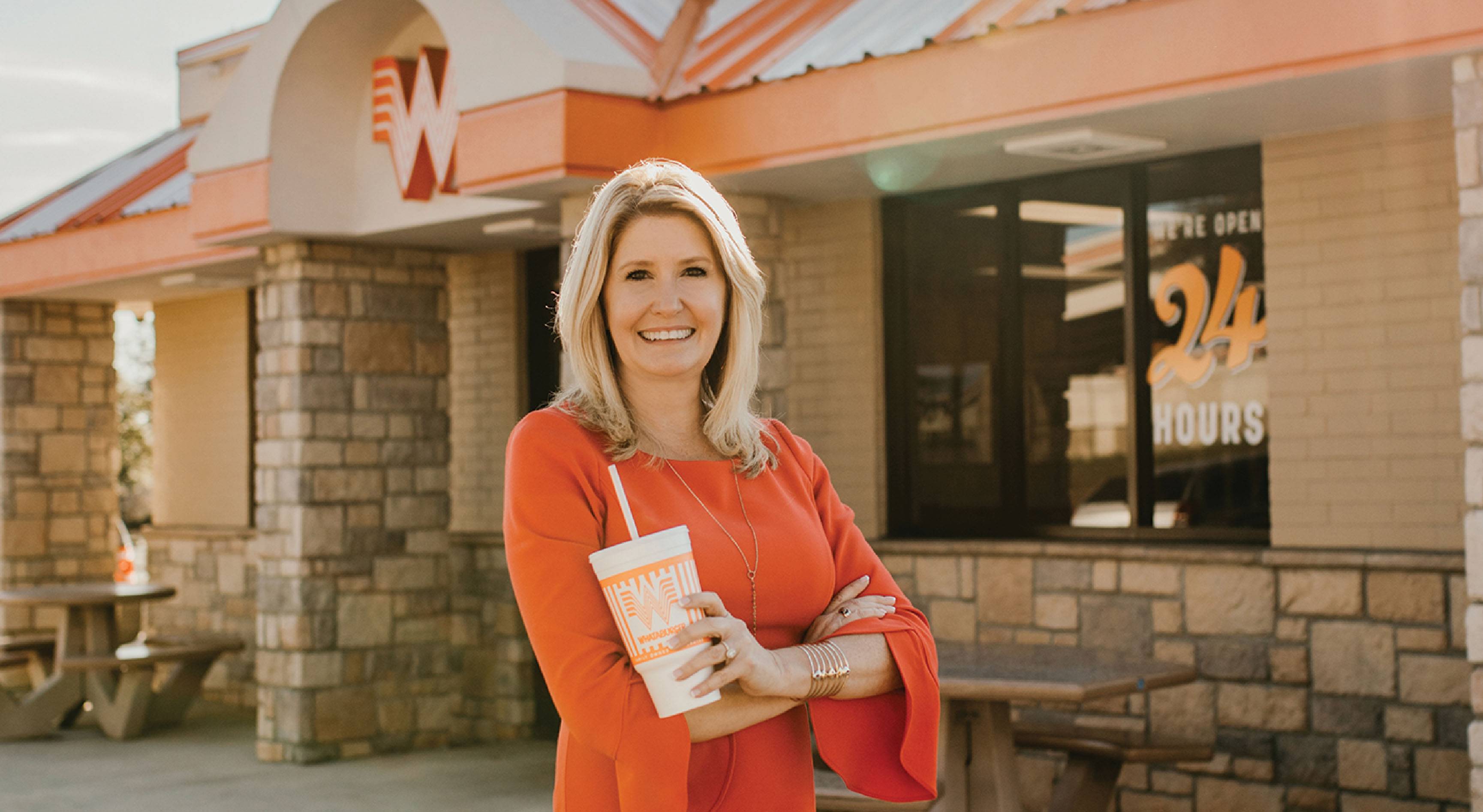 woman standing in front of restaurant