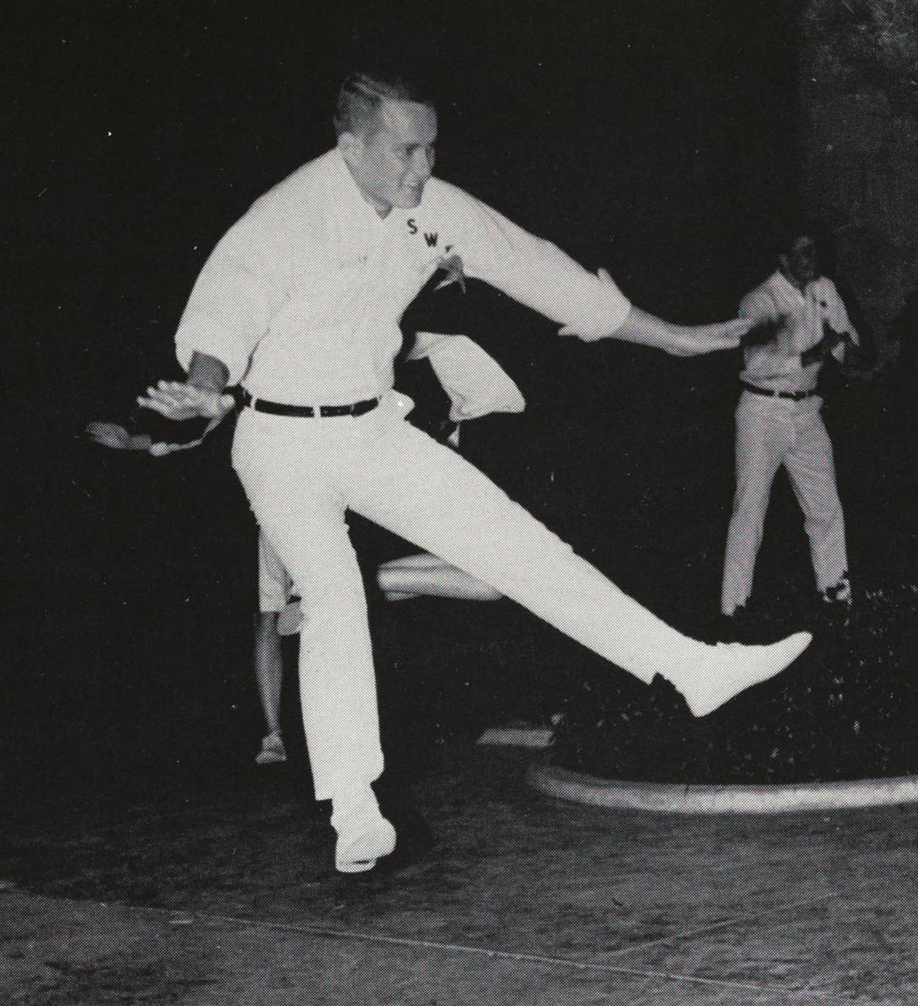 black and white photo of male cheerleader