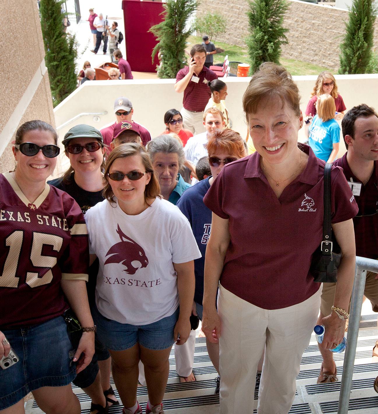 dr trauth standing and smiling with group of people on stairs