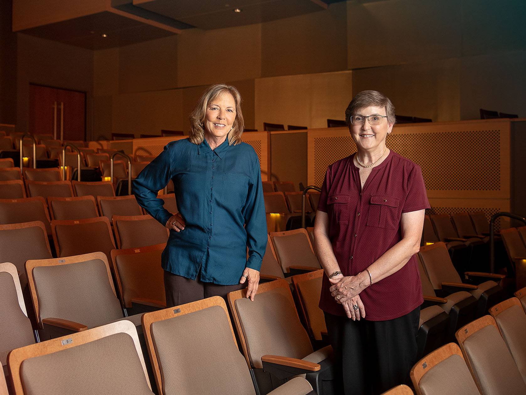 FitzPatrick sisters standing a row apart in an auditorium. 