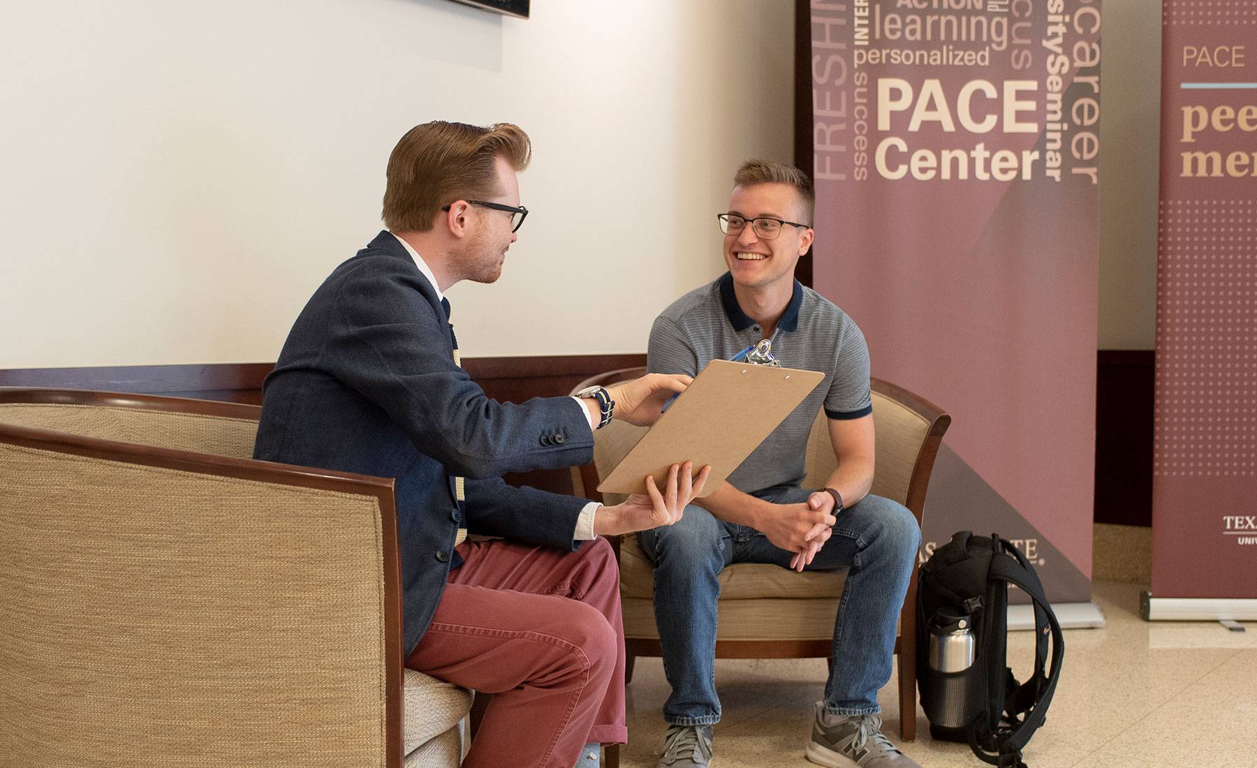A student consults with an academic advisor.