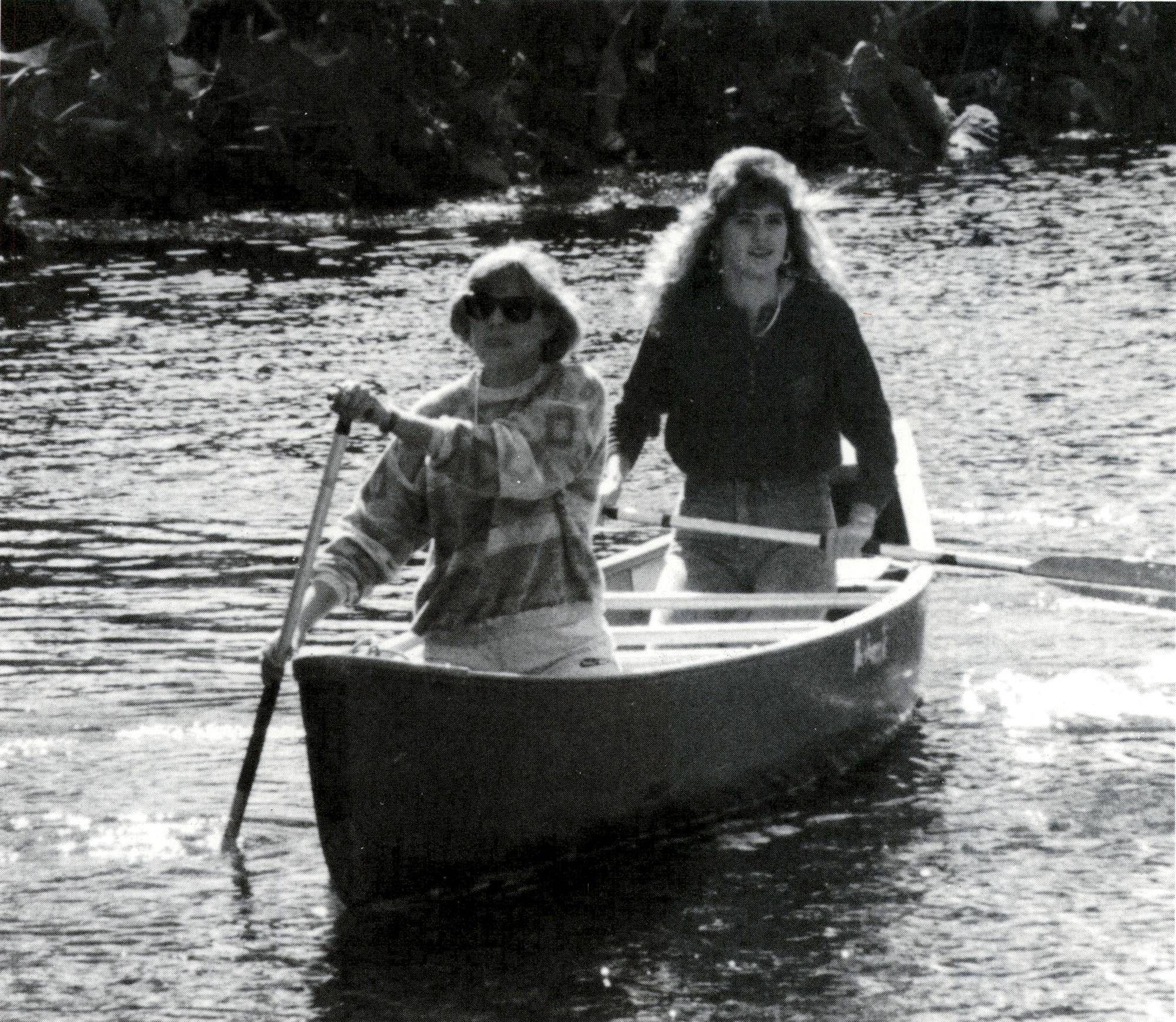 black and white photo of two women in a canoe on the san marcos river