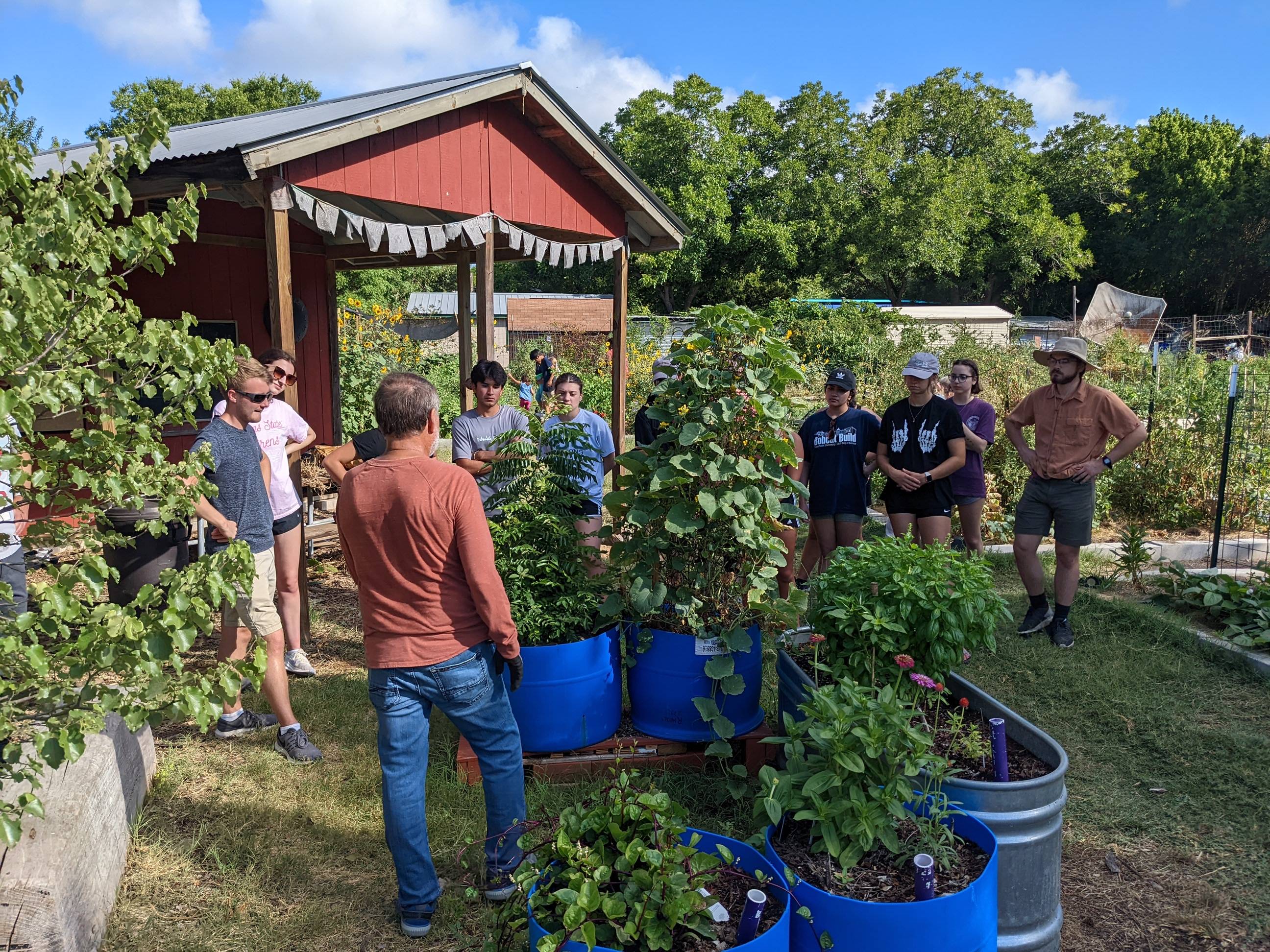 Students visit the San Marcos community garden.