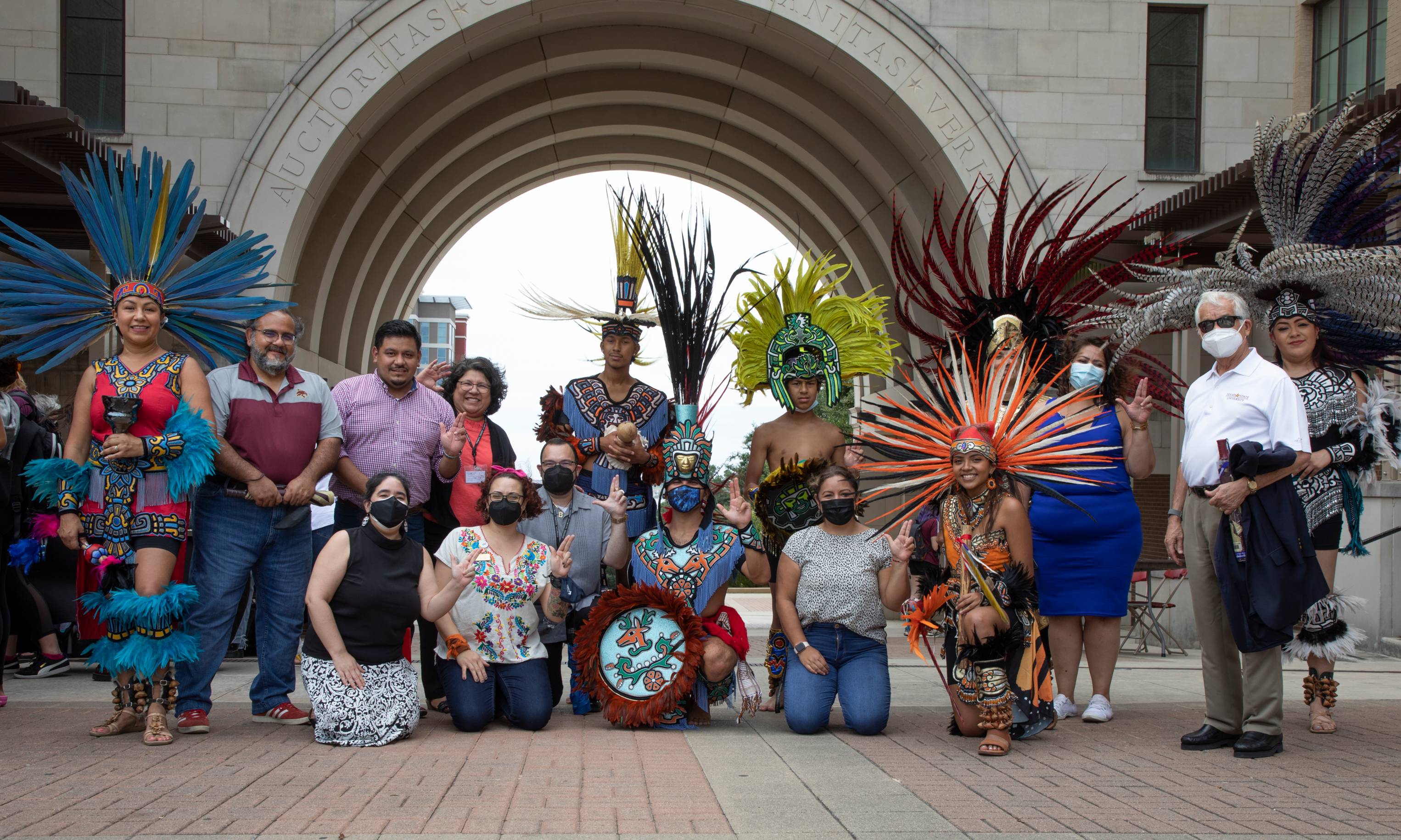Group picture with Aztec Dance Company and Texas State Staff