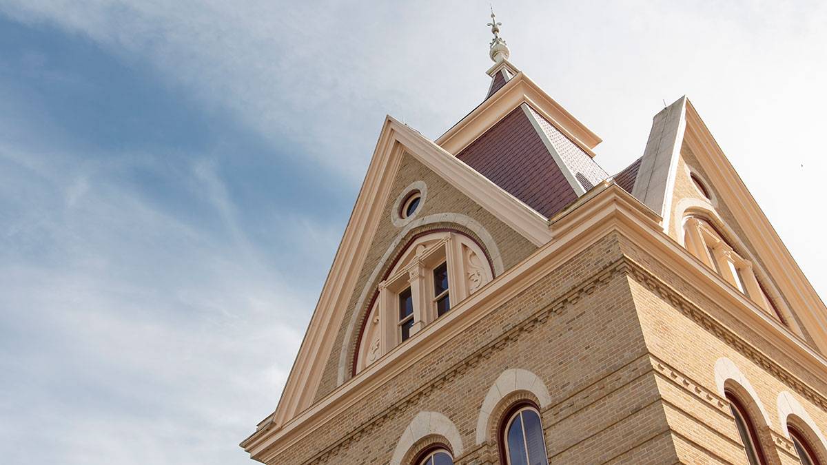 Photo of the Old Main turret and surrounding sky.