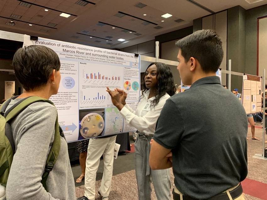 student presents summer research via poster session