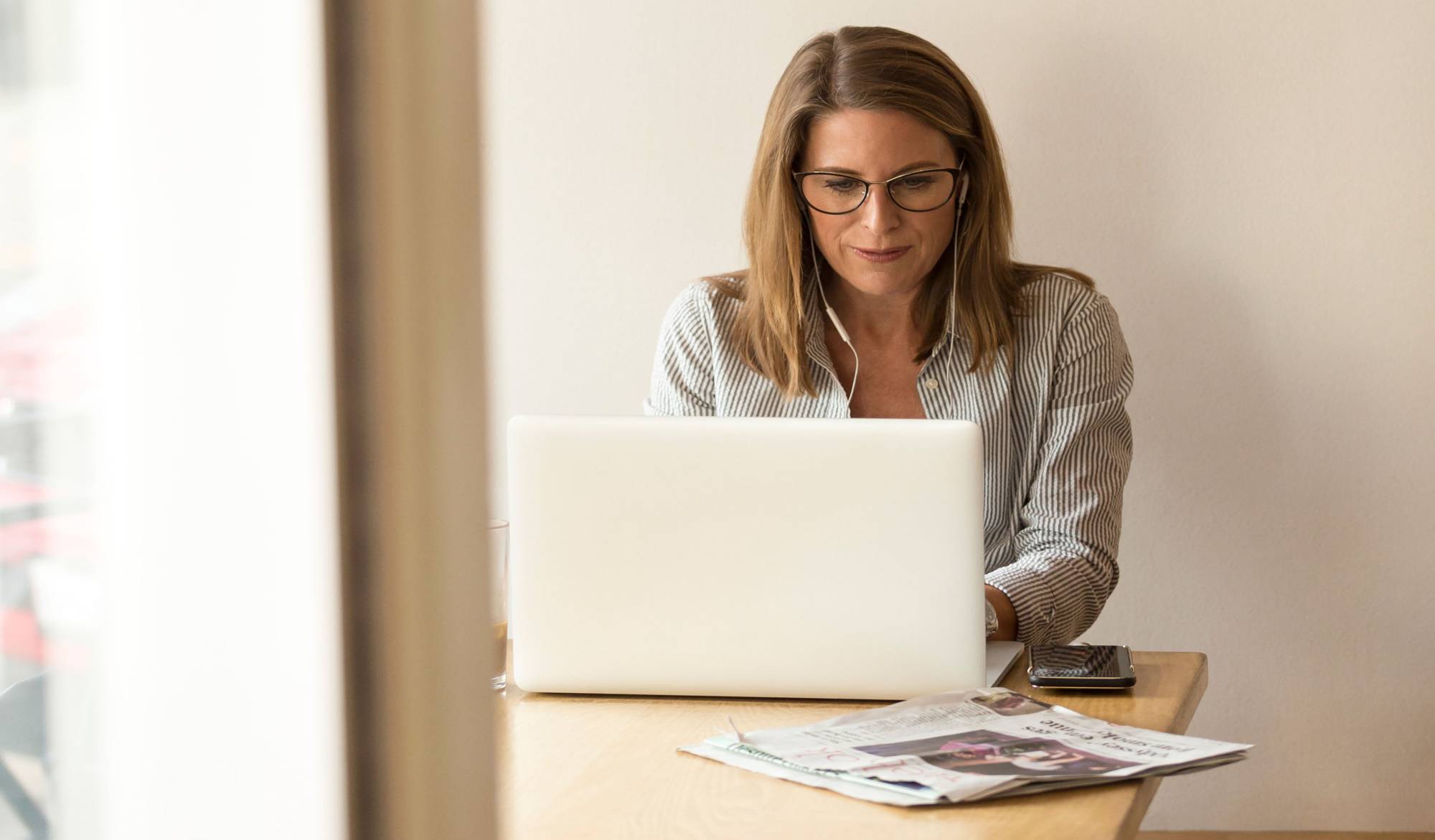 woman sitting in front of laptop