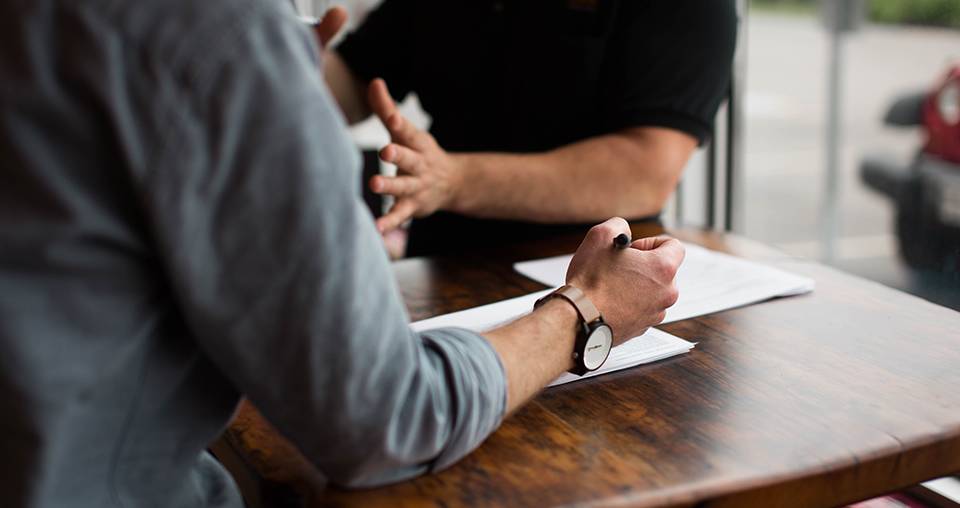 people talking at a table