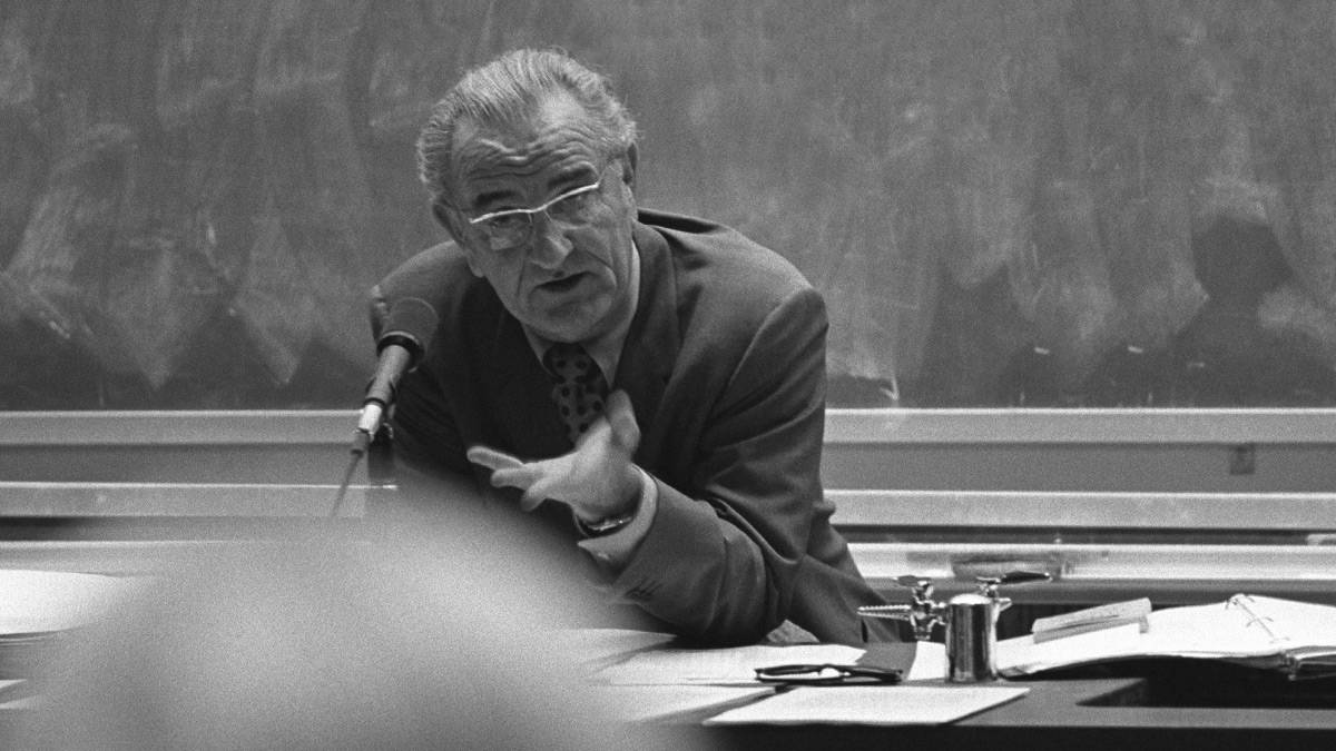 Lyndon B. Johnson speaks to students in a classroom at Texas State University