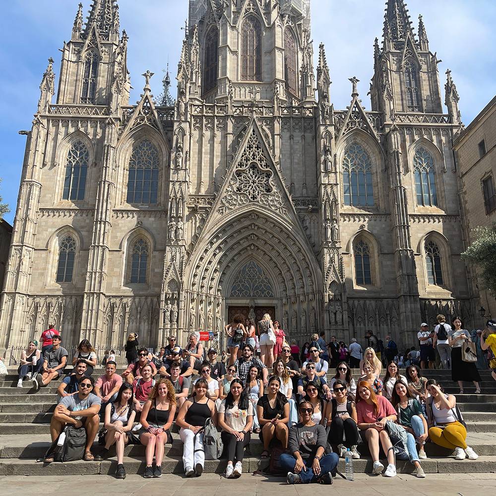 Students in front of historic building in Barcelona, Spain