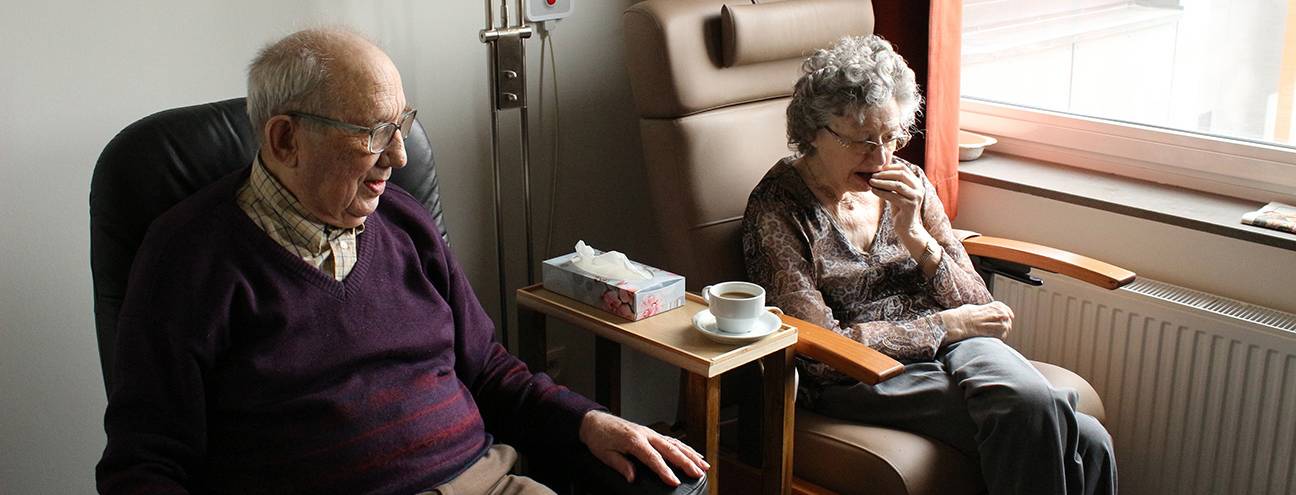elderly couple sitting