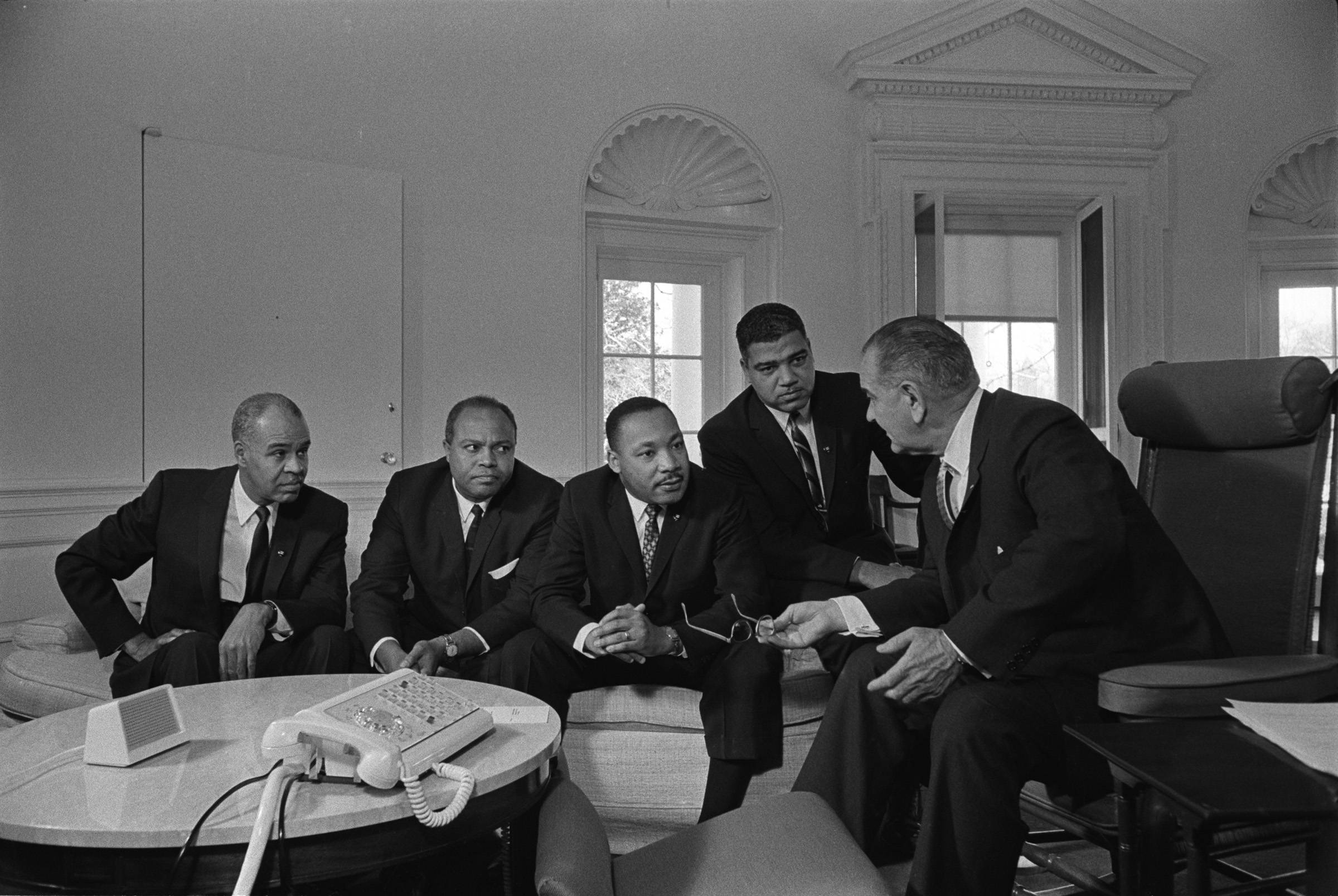 lbj talking to martin luther king and others about the civil rights movements at the white house