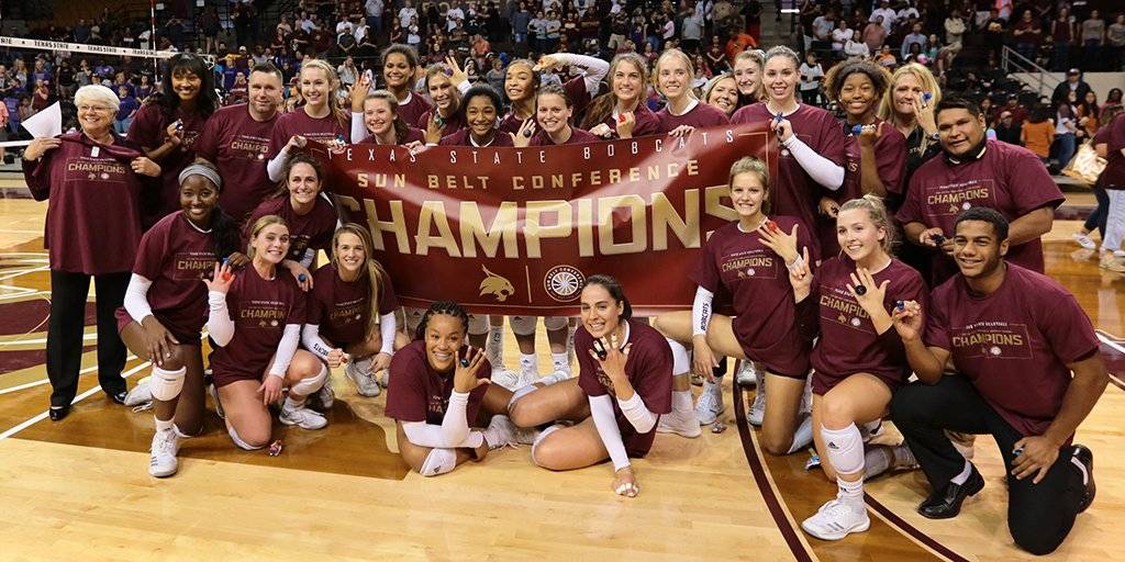 volleyball team with champion banners