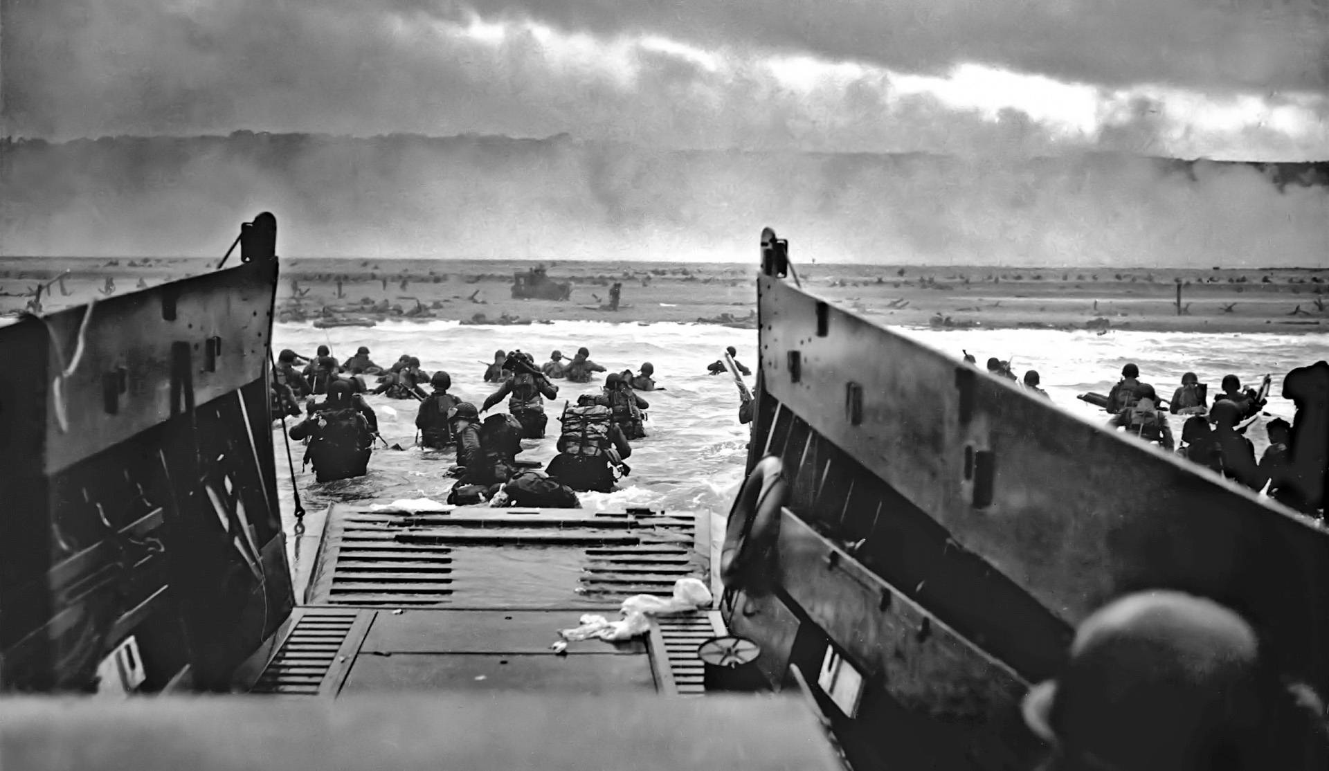 black and white photograph of soldiers on normandy beach