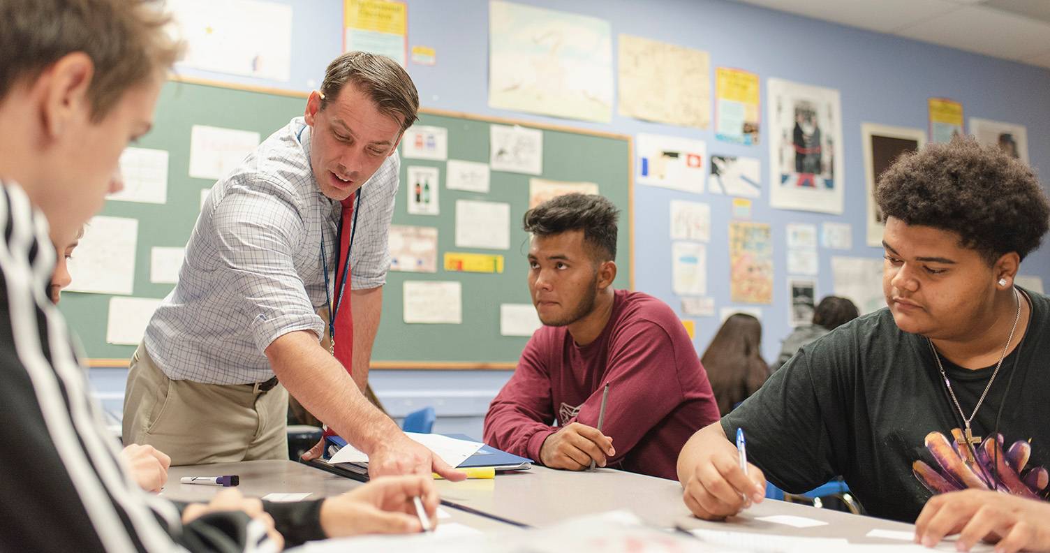 teacher with three highschool students