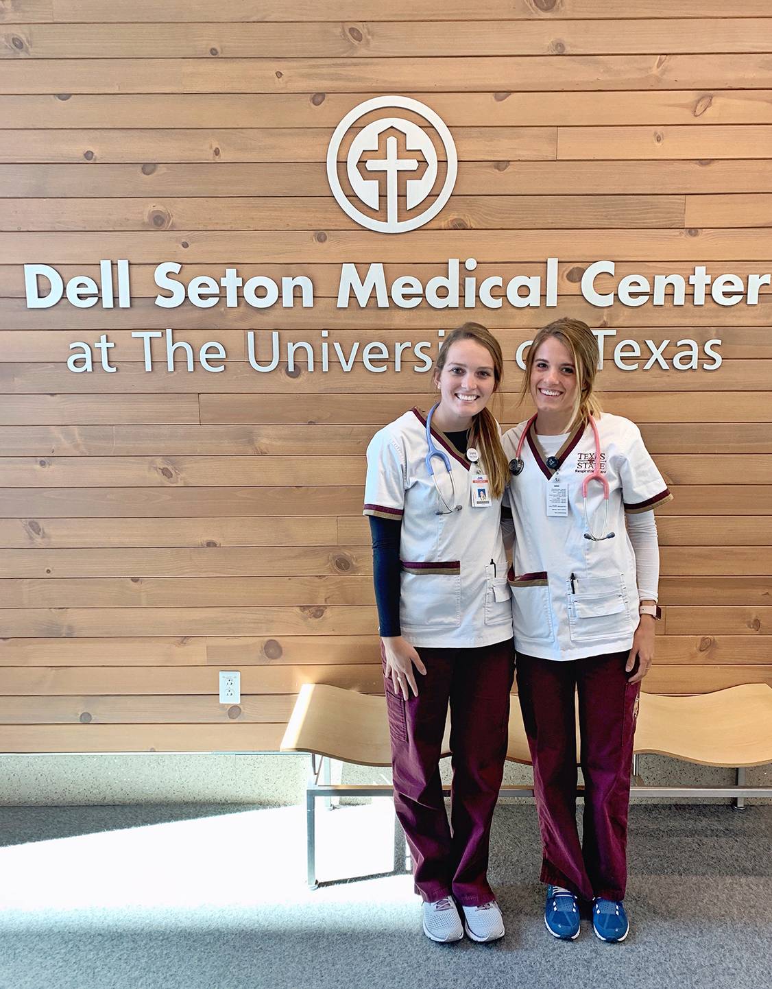two students in front of medical center sign