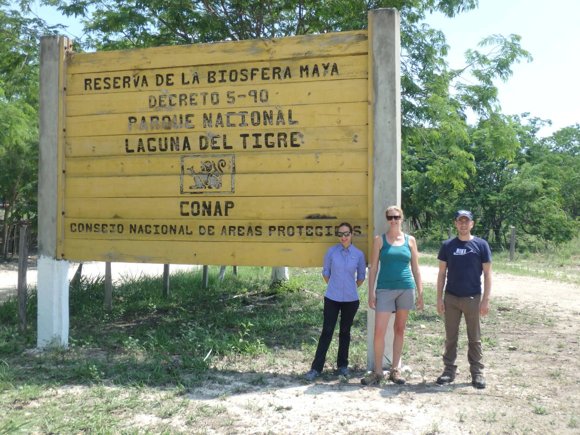 researchers in front of sign