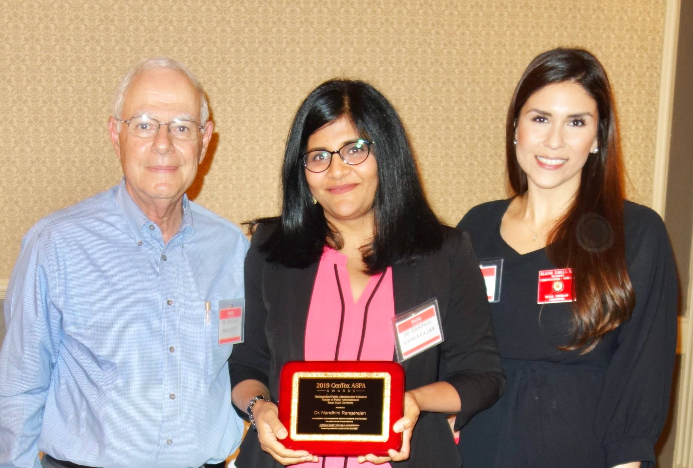 Dr. Nandhini Rangarajan holding her award
