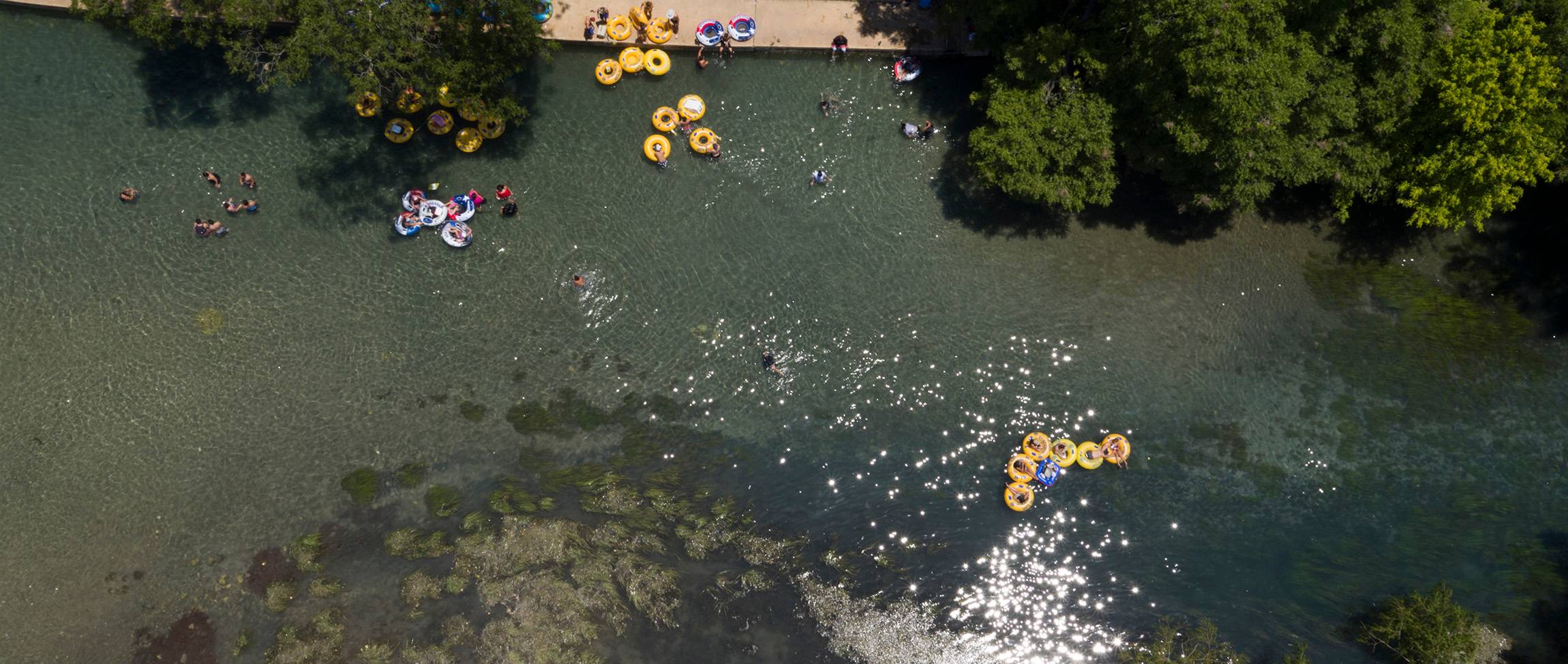 people tubing down san marcos river