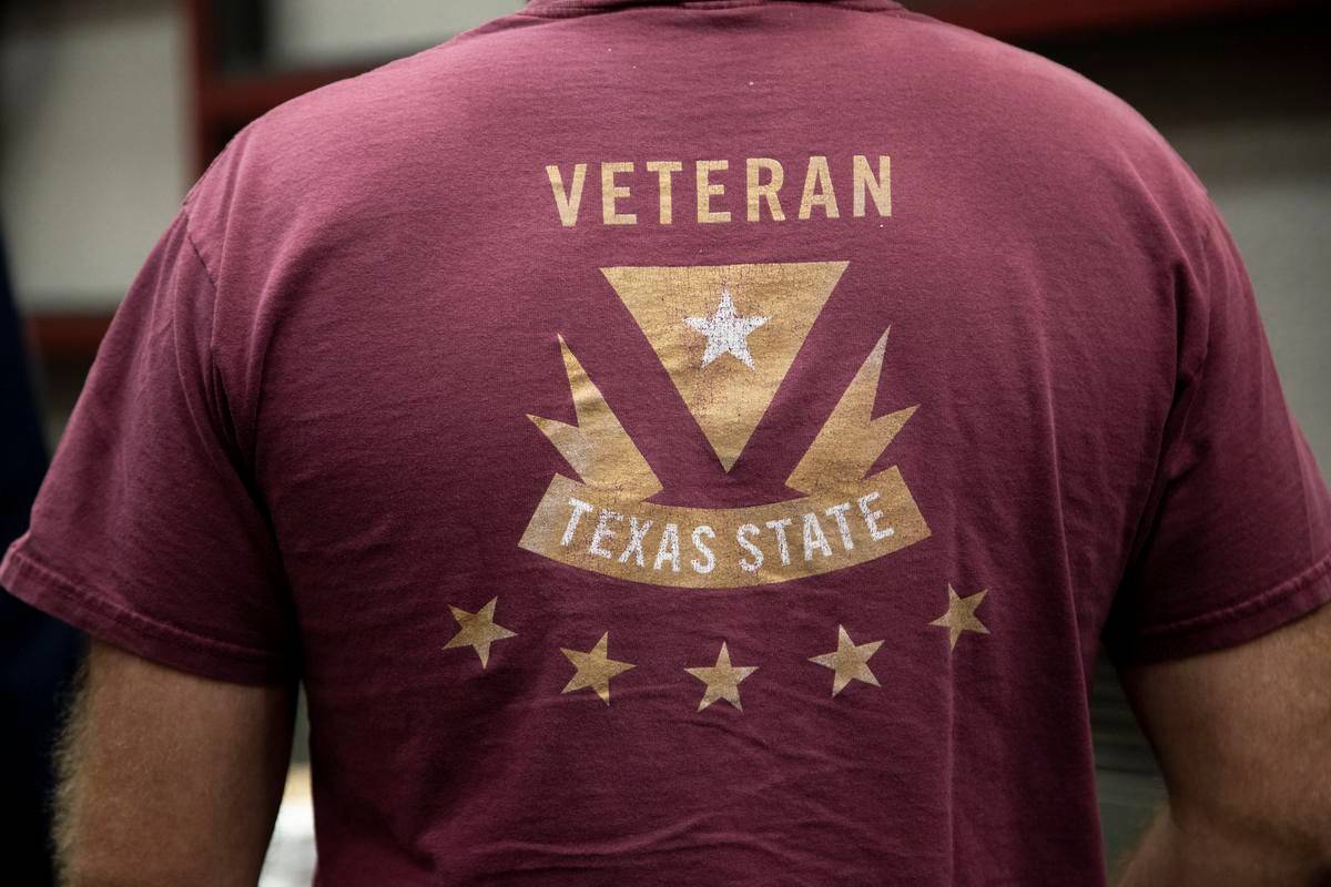 man wearing shirt reading "veteran texas state"