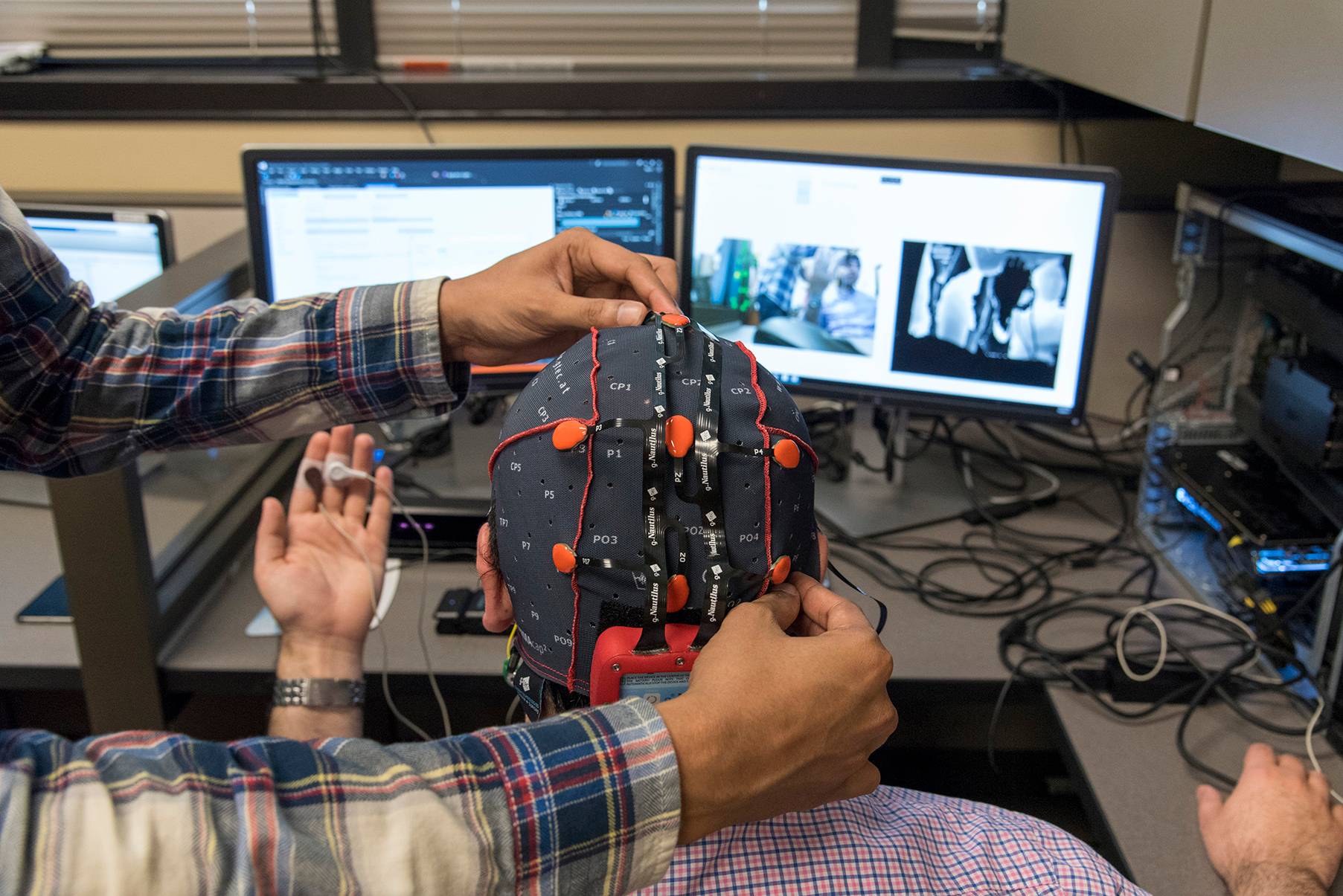 man with diodes on head for computer science research