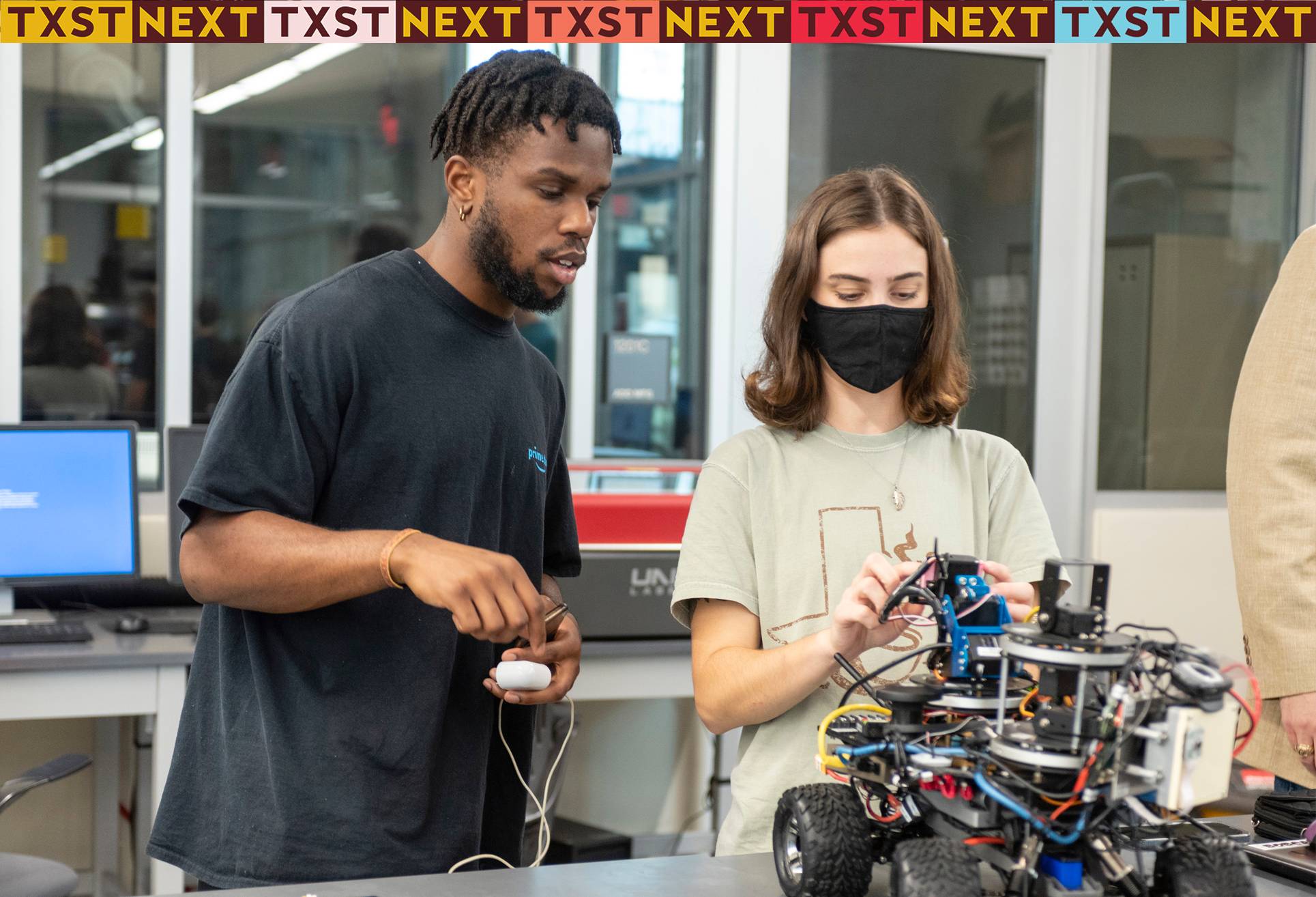 two people working on mechanical project