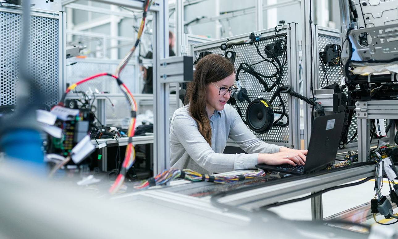 woman working on machinery