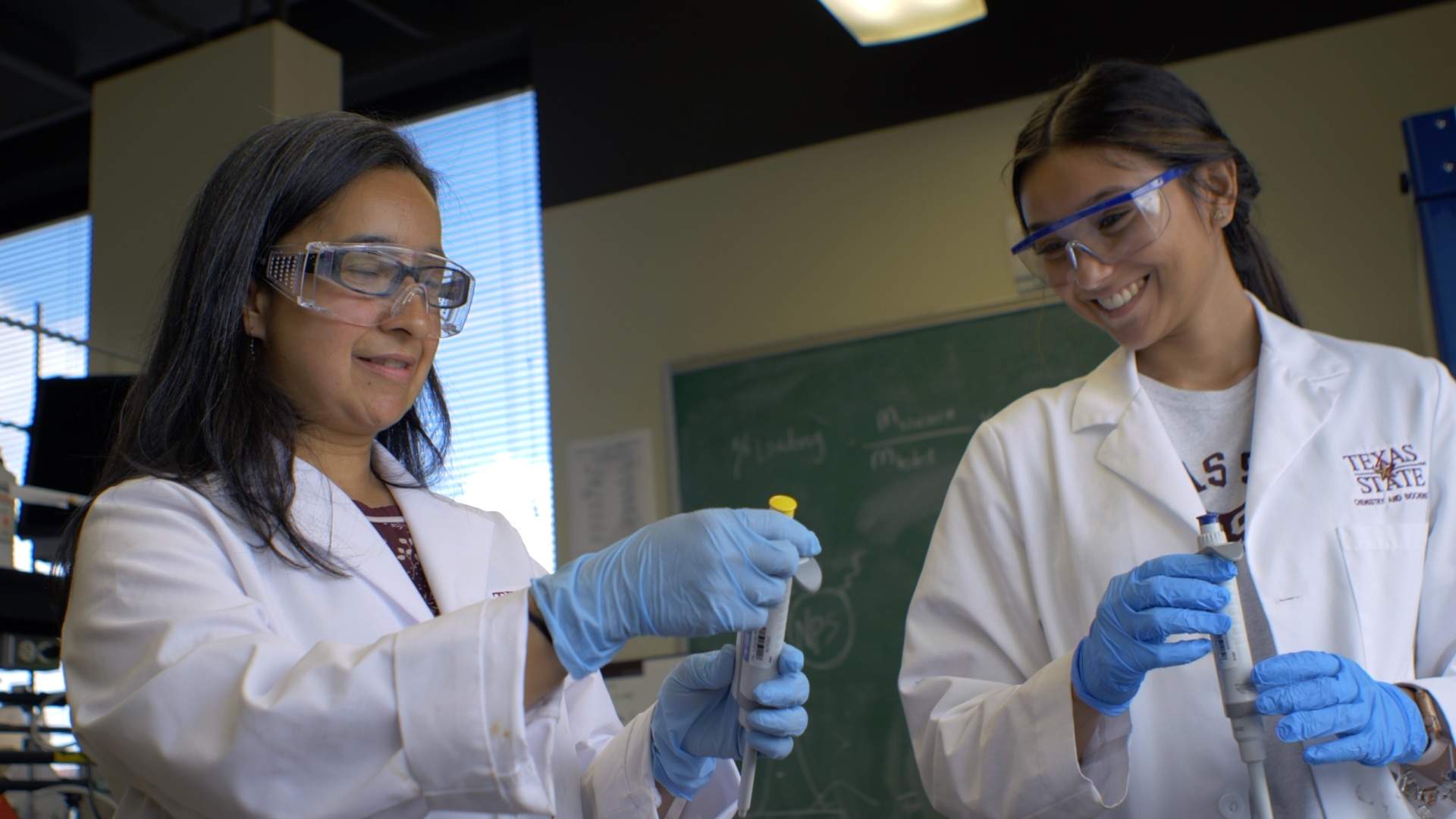 A faculty member and student in the lab.